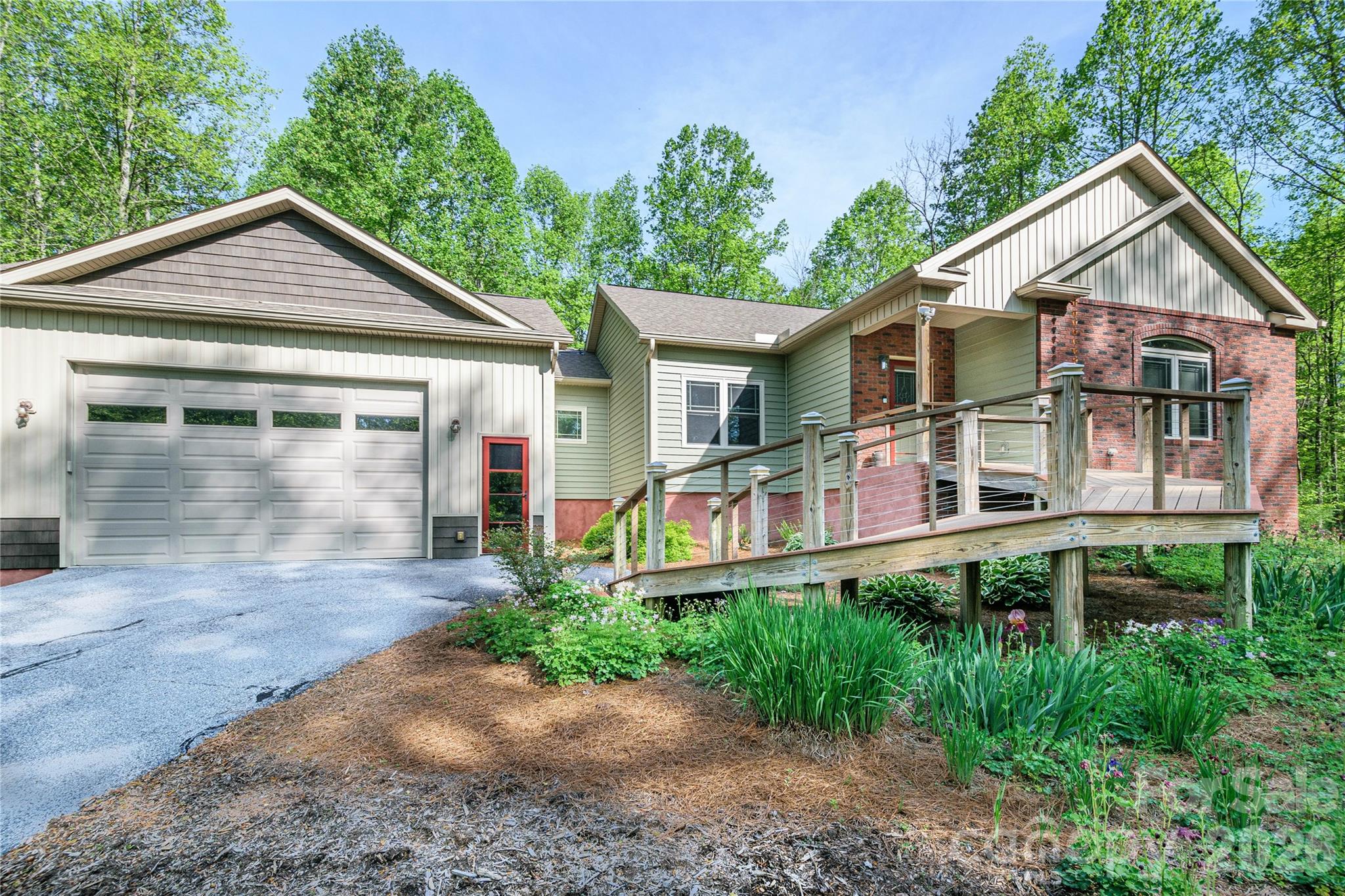 This meticulously maintained 2594+-sf of SUPER Energy efficient 3-bedrooms, 3 full bath home is nestled on a huge 1.44+- wooded acre lot. SUPER efficient? Yes. How about less than ONE DOLLAR A DAY electric bill for the April to May electric billing cycle. Yes, that is for a whole billing cycle. That validates the benefits of the professionally installed 18 panel - expandable solar power system with 2-10KW storage batteries supplementing the supply. This quality-built home features 9-foot ceilings, authentic Oak hardwood floors, Mission-style cabinetry, granite countertops, gas cooktop, easy reach built-in oven and dishwasher. You will love the main level spacious primary bedroom, and ensuite bath with Infinity shower. Main level also houses the second bedroom, full bath, and laundry with storage. How about relaxing or exercising in your own 224+- sf climate-controlled attached spa room w/8x11 swim spa? Or sipping your favorite beverage while relaxing on the screened in porch, enjoying the local deer family visits. Property adjoins large acreage to the rear which provides excellent wildlife habitat. Downstairs has its own laundry closet, bedroom, full bathroom, concrete patio and entrance. Downstairs also features a huge pantry or storage area. Are you looking for income from a rental, an Iin-laws suite, house your home business, or just a place to send the kids? Come and see the possibilities. Additional features include 10' tall garage door, composite decking, on-demand hot water, 6-inch gutters with guards and low maintenance exterior. 2x6 wall construction, R-19 wall insulation, and insulated composite siding. Not in subdivision. No road maintenance fees and NO HOAs. Fronts to NCDOT maintained dead end road. Plenty of paved parking. Convenient, desirable location between Hendersonville and Brevard with quick access to many area amenities including golf, Ecusta Trail, Pisgah Forest and Dupont State Forest. Call today!