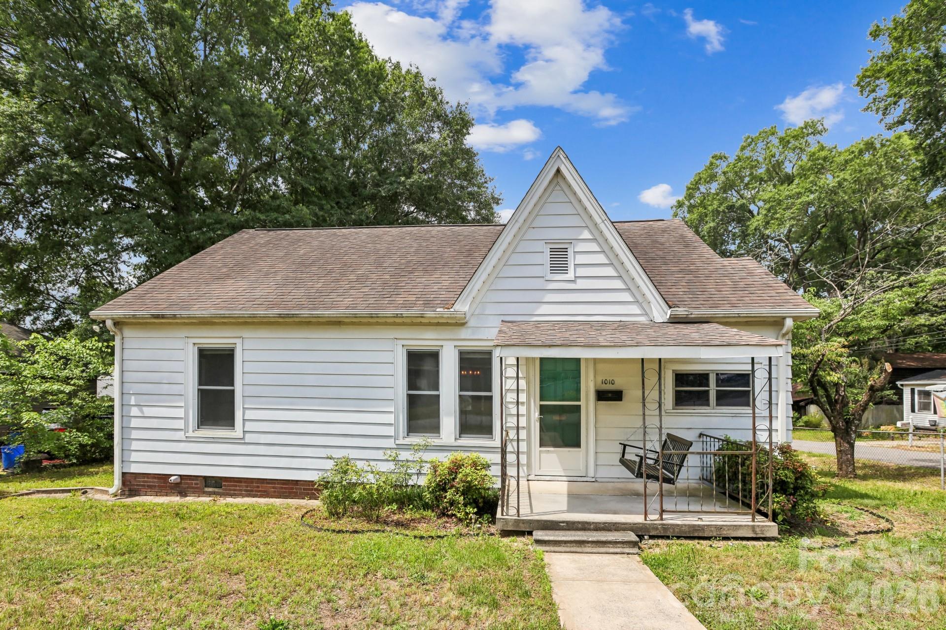 Welcome home to this quaint and inviting 2-bedroom ranch that combines classic charm with valuable updates and practical amenities. Situated on a fenced lot, this well-maintained property offers comfortable living spaces, beautiful hardwood floors, and plenty of room for everyday living and entertaining.
Inside, you'll find a warm and welcoming atmosphere highlighted by original character and updated windows that allow natural light to fill the home. The spacious dining room provides the perfect setting for family gatherings, holiday meals, and entertaining guests. Hardwood floors throughout much of the home add timeless appeal and easy maintenance.
The home features two comfortable bedrooms and one full bathroom, offering a functional layout for a variety of lifestyles. Important updates provide peace of mind, including a newer roof, newer HVAC system, and a new water heater.
Additional features include a detached one-car garage with electricity, ideal for parking, storage, hobbies, or a workshop, as well as a convenient carport for additional covered parking. The crawl space has a water vapor barrier that is in good condition, reflecting the care and maintenance invested in the property.