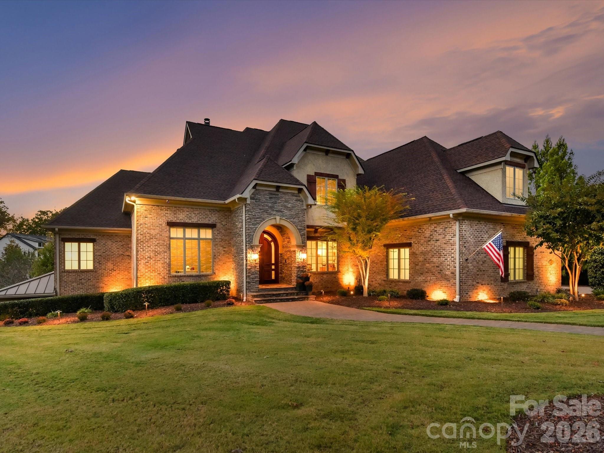 This masterfully reimagined estate offers the rare chance to own a residence that feels like new construction without the wait. Leaving no stone unturned in its recent upgrades, the property boasts incredible structural integrity with its full brick, stone, and stucco exterior, a new roof (2022), and updated HVAC systems (2022) featuring advanced UV air filtration. Inside, the Culinary Atelier showcases Wolf and Subzero applicances and extensive Mouser custom cabinetry with interior lighting, while a 2,000-pound vault door ensures peak security. Designed for the ultimate entertainer, the home features a resort-style aquatic oasis with a heated saltwater Gunite pool—refinished in 2021 with premium PebbleTec and added spa and travertine surround—and a professional outdoor kitchen equipped with Lynx appliances, fire bowls, and genuine Hawaiian tiki torches. Recreational amenities include a dedicated Full Swing® Simulation Room and a three-person infrared sauna. The professionally re-graded grounds, featuring Bermuda TifTuf, are maintained by a private 850-foot deep irrigation well. With dual laundry suites, ensuite bathrooms for all oversized bedrooms, and massive screened porches with Brazilian Ipe accents, this home represents a perfect synergy of luxury, technology, and convenience.