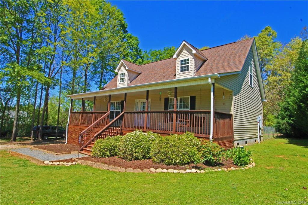 A MUST SEE! Immaculate well maintained beautiful 3 bedroom 2 1/2 bath home with a full length covered porch located on one acre.  New paint throughout the home.  Master Bedroom has private bath with dual vanities. Laundry room and half bath on main level.  Large living room with beautiful laminate floor that continues into the dining room/kitchen. Step out onto a large deck that overlooks a spacious fenced in backyard.  Two large bedrooms/full bath on upper level. Call for an appointment today!