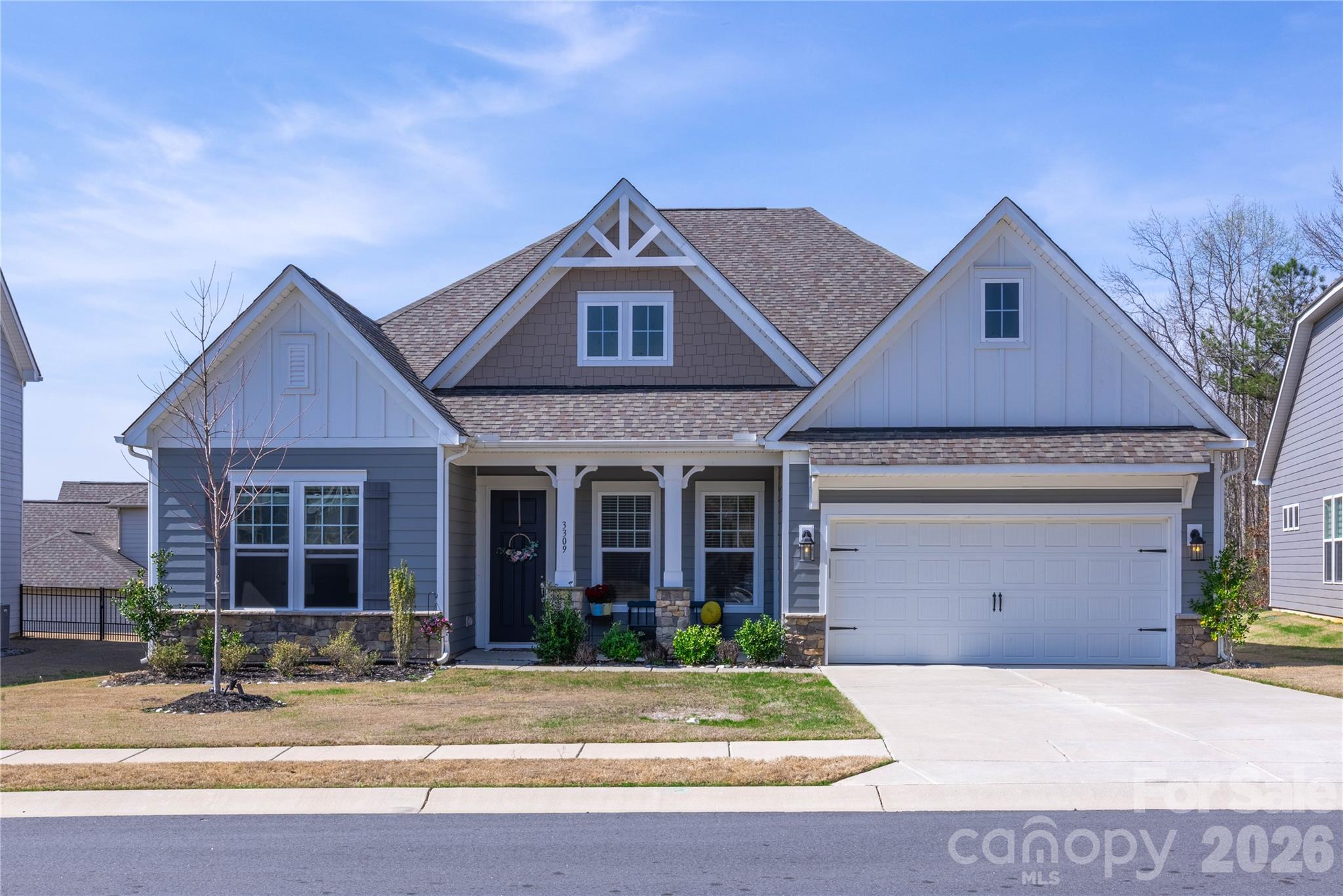 Located in a quiet Indian Land cul-de-sac, this single-story home offers quick access to Ballantyne, shopping, restaurants, and health care facilities. It features an open layout with a formal dining room, great room with gas log fireplace, and a kitchen with a large island, farmhouse sink, wall oven, microwave, and gas cooktop. Luxury vinyl plank flooring extends through the kitchen, dining, and breakfast areas. A guest suite has a private bathroom; two additional bedrooms share a full bath. The primary bedroom includes a garden tub, tiled shower, and walk-in closet. The neighborhood has a community pool. Low Lancaster County taxes.