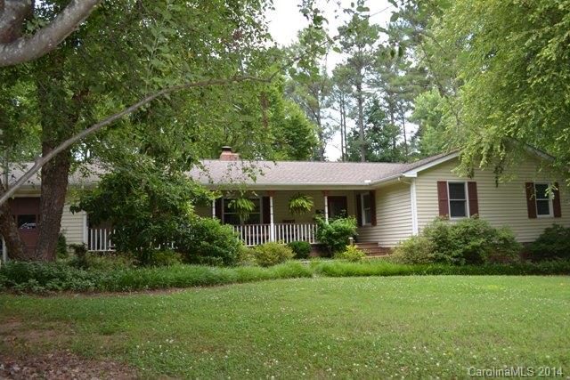 Awesome country setting on 2 acres!  The property has so much to offer.  Double attached garage plus a detached double garage/workshop with loft.  Great storage for boats or RVs.  Home offers living room with fireplace, dining room and a great room with built-ins.  You will love the kitchen with tile counter tops, gas cooktop that can be converted to electric. Lots of cabinets with some glass fronts.  You will love the HUGE screen porch which has sliding windows to close in the winter time.
