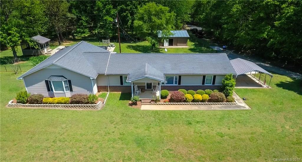 One of a kind property! Well maintained home features main level living w/ 3 bedrooms & 3 baths. Huge Master suite w/sitting area/home office nook, oversized walk in closet & bath. In ground basement w/ large entertaining space +2 additional rooms. Backyard oasis w/ pool & diving board & fountain, screened in pool house w/1/2 bath & bar. 24'x30' shop with an additional 10'x30'storage off that. Wired for generator on its own panel. Home is surrounded by 50 acres of private owned property.
