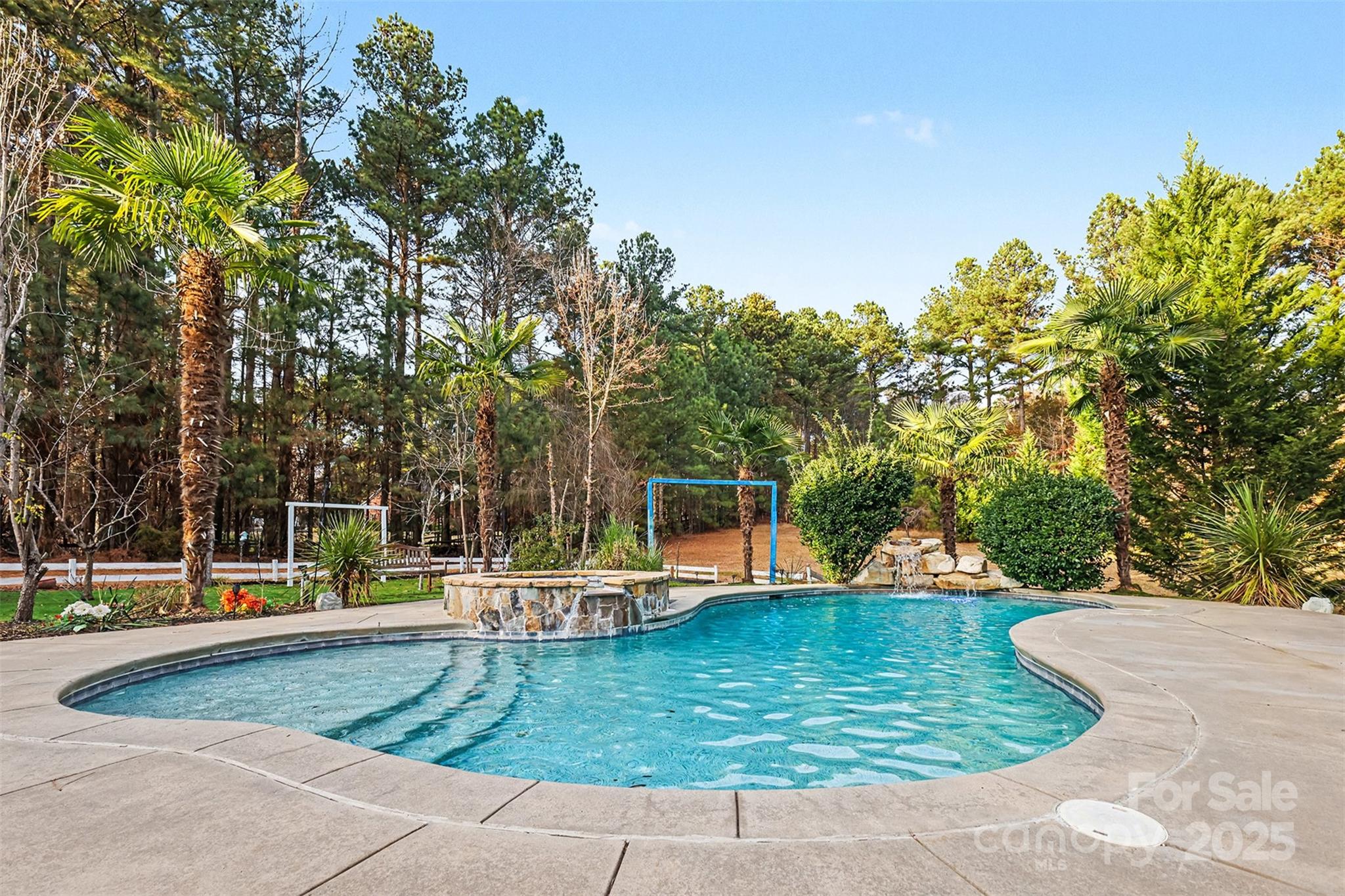 Custom-built home with a private pool and hot tub—perfectly positioned just steps from the shores of Lake Wylie. This thoughtfully designed residence offers 3 bedrooms plus a bonus room on the upper level that could be used as an additional bedroom, 3 full baths, and 2 half baths, with an open, free-flowing layout filled with natural light and inviting spaces for everyday living and entertaining. The main level features spacious living and dining areas, a well-appointed kitchen, and a convenient secondary suite ideal for guests or multi-generational living. The lower level is home to the private primary bedroom retreat, offering separation and quiet, along with generous closet space and a well-designed bath. Outdoor living is a true highlight, with a beautifully landscaped backyard centered around the pool and hot tub, complemented by two screened-in porches—ideal for relaxing or hosting gatherings. Located in a peaceful Lake Wylie community, this custom home blends comfort, privacy, and thoughtful design in a truly special setting.