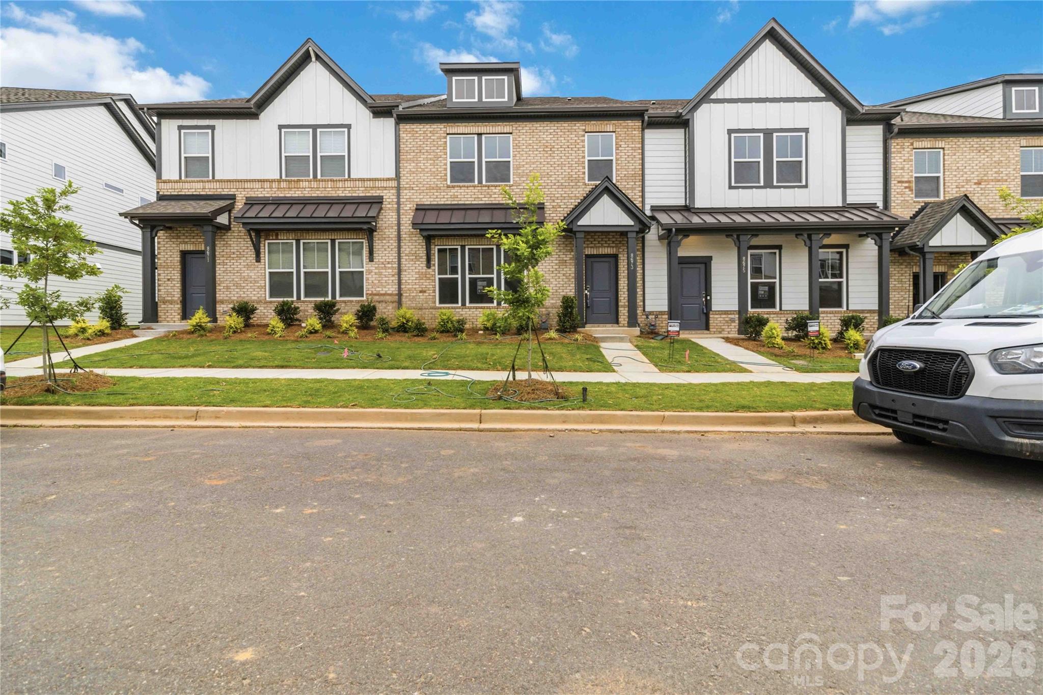 New Construction with May Completion! Built by Taylor Morrison, welcome to the Aspen floor plan at 8673 Miles Gap Road in the Ridge at Sugar Creek. Enter from the rear two-car garage into a thoughtfully designed main level featuring an open kitchen with a walk-in pantry, casual dining area, and a spacious gathering room positioned at the front of the home. A convenient half bath adds everyday functionality. Upstairs, a cozy loft provides the perfect space for relaxing or game nights, along with three bedrooms, a full bath, and a centrally located laundry room. The deluxe primary suite offers a private retreat with two walk-in closets, dual-sink vanity, and a beautifully designed shower. Photos are for representative purposes only. MLS #4322200