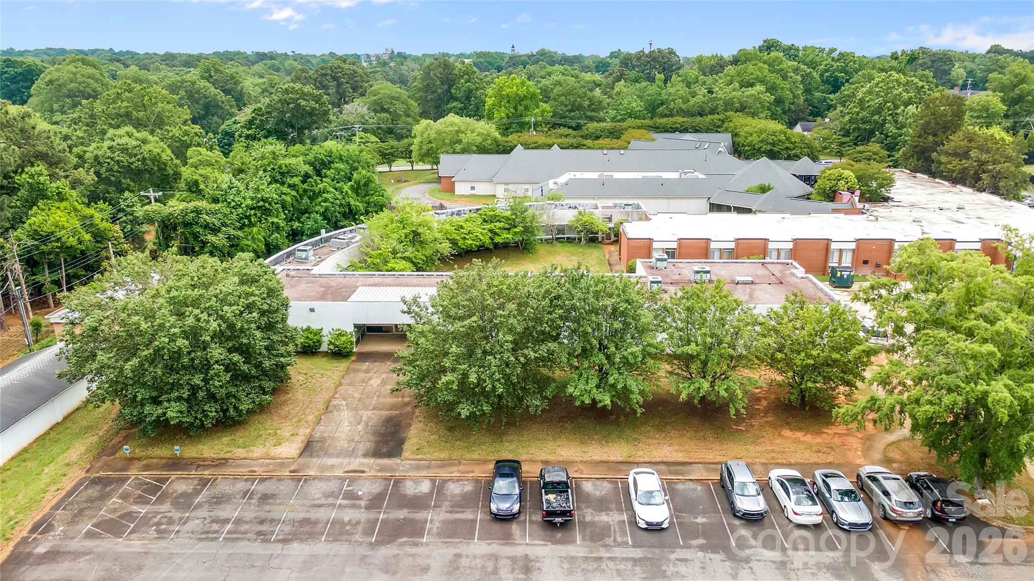 Prime commercial property opportunity in Rock Hill featuring 10,479 SF on 1.24 acres. Formerly Catawba Mental Health, this versatile facility offers 35+ parking spaces and an ideal layout for medical office, governmental, educational, or institutional use. Conveniently located with easy access to major roadways, local businesses, and surrounding amenities.