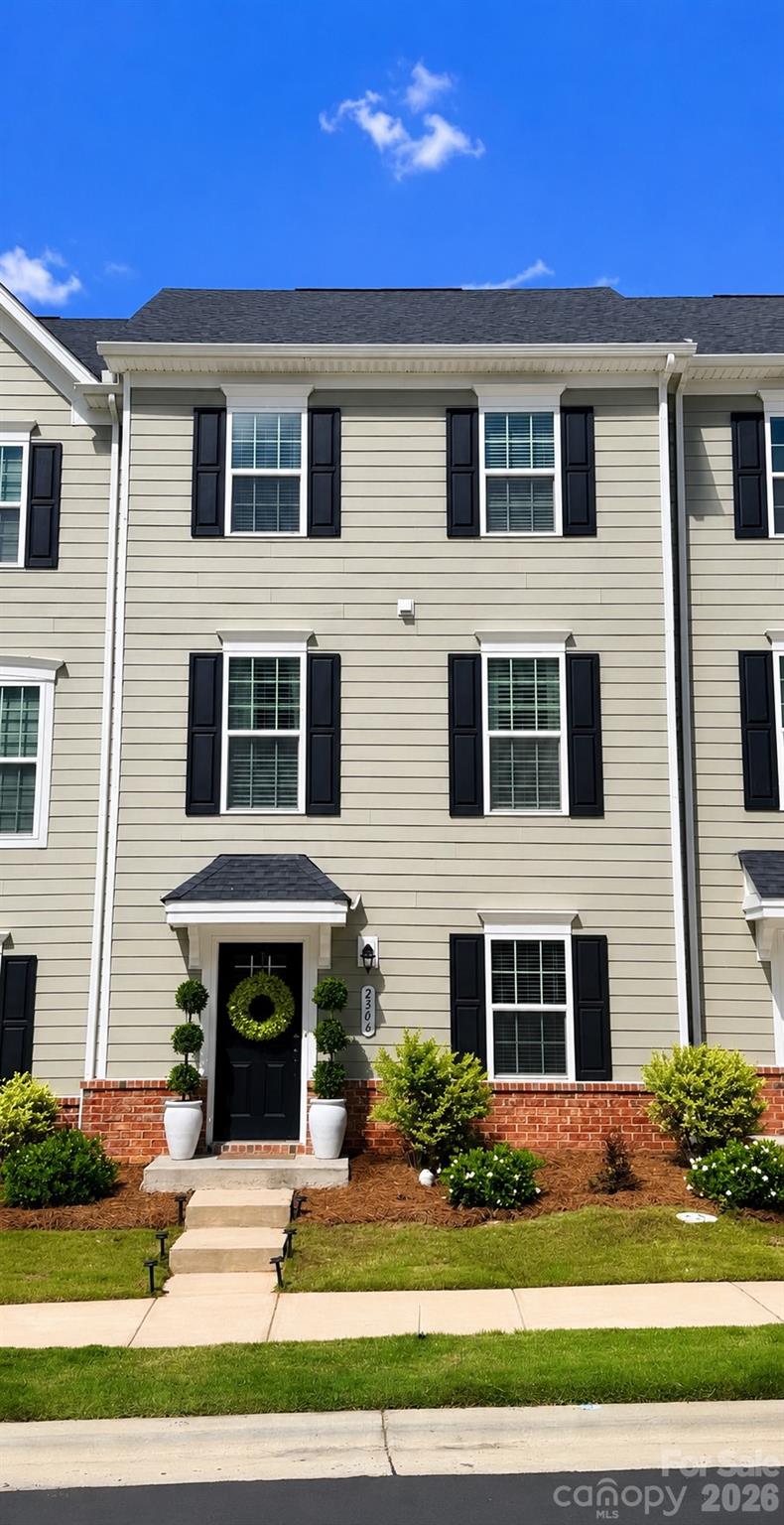 Welcome to 2506 Autumn Olive Lane, a stunning like new 3-story townhome located in Stone Creek Townhomes community in Matthews, NC. Built in 2023, this beautifully maintained 3-bedroom, 2.5-bath home offers modern living with custom upgrades and designer finishes throughout. The open-concept main level features abundant natural light, a spacious living area, and a gourmet kitchen complete with quartz countertops, stainless steel appliances, a large center island, modern cabinetry, and a stylish custom coffee bar perfect for entertaining. Elegant chandelier light fixtures, upgraded mirrors, and thoughtfully curated finishes add a luxurious touch throughout the home. The custom-designed primary suite serves as a private retreat with designer accents and a spacious walk-in closet with custom organization features. Additional bedrooms provide flexibility for guests, office space, or family living. Enjoy low maintenance living with attractive curb appeal, professional landscape