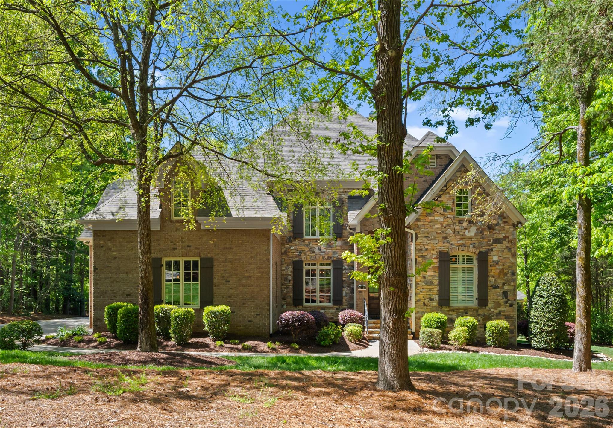 GREAT OPPORTUNITY!!!!! Offered furnished, with furnishings included in the list price, this exceptional estate presents a rare turnkey opportunity in The Sanctuary with resort-style amenities and ultimate privacy on more than 3 acres. This refined 5-bedroom residence blends sophisticated design with exceptional livability, featuring high-end finishes and an elevator connecting multiple levels of thoughtfully curated space. A gourmet kitchen with top-tier appliances and open-concept layout creates a seamless flow for entertaining and everyday living. The main-level primary suite offers privacy and elegance, while the upper-level bonus room includes custom built-in bunk beds and additional flexible space. A fully equipped second living quarters with basement features a bedroom, kitchen, gym, sauna, steam shower, and full bath—ideal for guests or multigenerational living. The expansive basement also includes a wine cellar and ample storage. Outdoor living is unmatched with lush landscaping, an in-ground pool/spa, outdoor kitchen, and fireplace. A 4-car garage completes this exceptional property, just minutes from the best Charlotte has to offer.