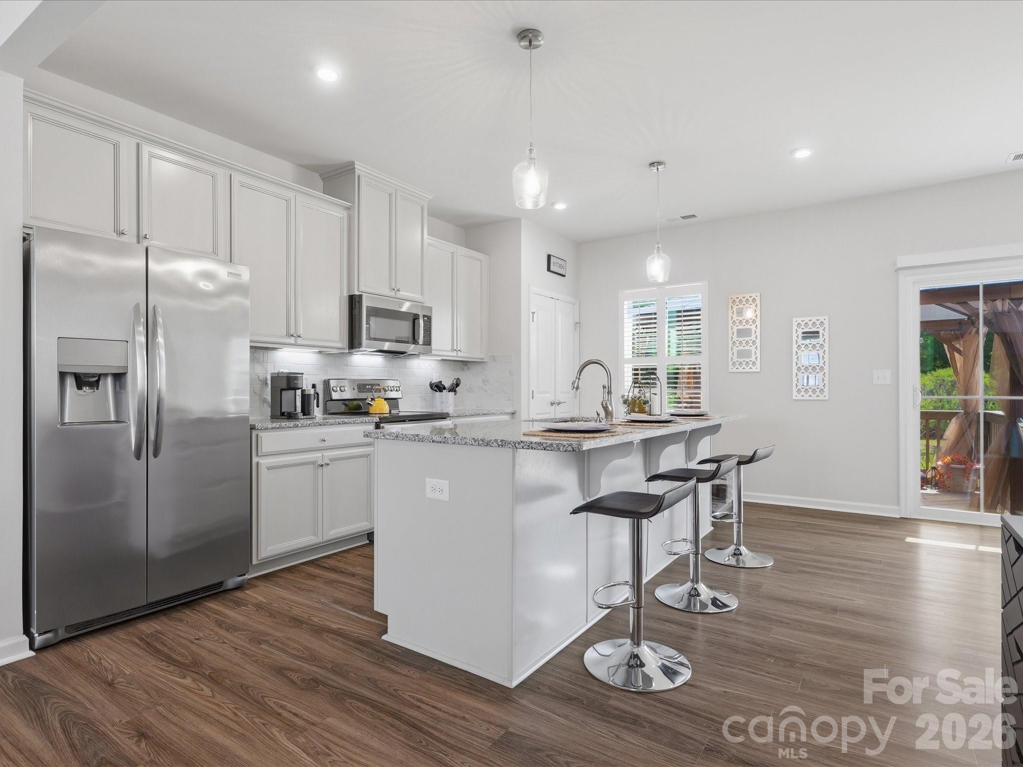 Unbeatable value meets waterview tranquility! This move-in-ready, 3-level townhome offers premium features without the hefty price tag. Located in Grantham Place of Regent Park, your commute stays easy and your home still feels like an escape.  The neighborhood offers wonderful amenities including walking paths, community pool, exterior maintenance, pickle ball and tennis courts, playground, and front gated community so you don't have to lift a finger and get to enjoy resort-style living. So what's the real difference from the average townhome?  You're not staring at your neighbor; you have a lovely water view right outside plus direct access to the trails when you need to unwind.  And this townhome is made for having people over: a covered patio downstairs and a pergola setup upstairs that gives you a true outdoor oasis. Inside, the layout gives you flexibility to grow with a flex room on the main floor with access to the two-car garage.  Speaking of parking, this driveway, unlike other townhomes, can actually fit more than two cars in it.  Which means less having to navigate parking schedules and more time to focus on what matters, like taking advantage of the close by dining, shopping, and amusement park. The open living room and spacious kitchen with dining area have room for everyone and still manageable enough of a size you're not dedicated to cleaning 24/7.  The best of both worlds! This gem of a home is stocked with all kitchen appliances to remain. Check out the matterport virtual tour for a real-time walkthrough of the property.