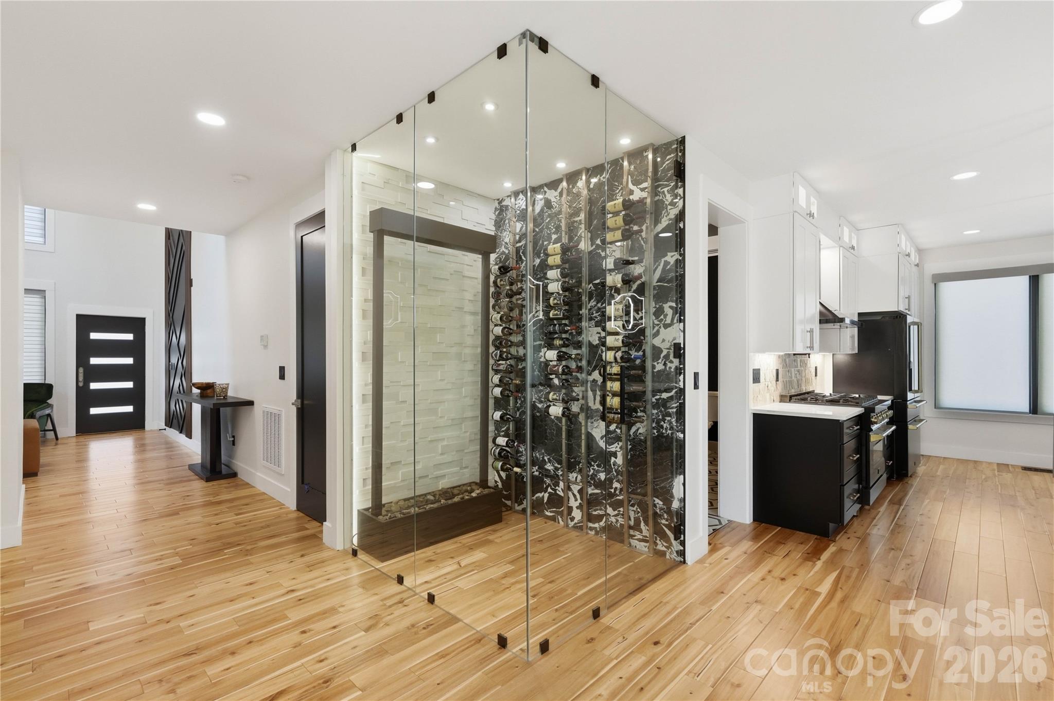 This exceptional Nearly New Construction home perfectly blends modern sophistication and timeless elegance with High-End Upgrades & Finishes, Exotic Stone Tile, Rare Quartz countertops, and beautiful Hand Notched Asian Walnut Hardwood Floors throughout. Located in highly desirable Villa Heights/Plaza area,  this home offers convenient access to some of the city’s best dining, entertainment, and local hotspots while maintaining the charm of a close-knit community. Thoughtfully designed for today’s modern lifestyle, the spacious floor plan features five bedrooms, including a versatile main-level suite ideal for a home office or guest retreat.

From the moment you enter, the attention to detail is apparent. The 2-story Foyer is compliemnted with a Grand 2-story sitting area and fireplace. Rich hand-notched Asian walnut flooring flows throughout the home, bringing warmth and character to every space. A sophisticated built-in All Glass Wine display adds an elegant focal point and enhances the home’s upscale ambiance.  At the center of the home is a stunning Chef’s Kitchen equipped with premium Autograph Collection ZLINE appliances including Gas Stovetop Range, Oven, and Refrigerator. An oversized Kitchen Island serves as the perfect gathering space for guests and family, beautifully accented by designer pendant lighting above bringing flair to the entire open-concept main floor.  Hidden discreetly behind the kitchen, the walk-in pantry offers additional storage while preserving the sleek, modern aesthetic. Overlooking the kitchen is the Grand Living Room with built ins, fireplace, and a thoughtfully designed Coffee Wetbar. This home has the best finishes and high-end details bringing a luxurious well balanced vibe throughout. 

The upstairs offers 2 primary-suites with their own High-End Spa like bathrooms. The Main Primary Suite has High Vaulted Ceilings and Access to the Second Floor RoofTop Deck Overlooking the Private Fenced in BackYard. An Additional 2 bedrooms and Massive Laundry Room cater to the second floor living. Luxury lighting selections throughout the home create a warm and inviting atmosphere, elevating each room with refined style. Expansive windows fill the home with natural light, highlighting the thoughtful craftsmanship and high-end finishes found throughout. Each window has High-end automatic blinds, bringing privacy and a touch of elegance throughout the home(70k in value). The Oversized Garage offers storage and is complimented with Premium Apoxy Floors, truly not a detailed missed on this masterpiece!