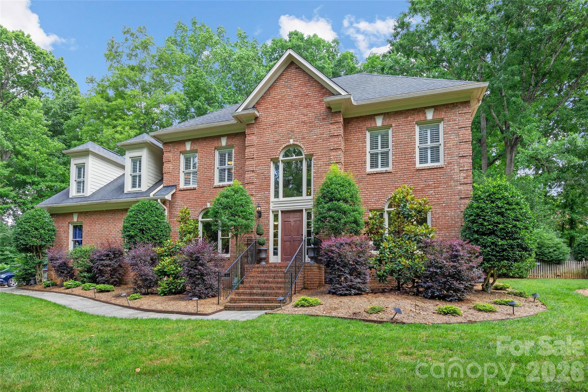 Located on a private drive in popular Carrington, 4709 Coburn Court offers a rare combination of privacy, fabulous interior features, and a backyard oasis all convenient to SouthPark, Ballantyne, and top-tier schools. 

The welcoming & open floor plan + large windows showcase the privacy setting and brings the opportunity for ease of daily living with wonderful light-filled connection to the outdoors.   

The first floor offers tremendous flexibility including a sitting room w /french doors perfect for office or extra living space, formal dining room, a custom bar with ice maker and beverage fridge, and an open great room. The kitchen is thoughtfully designed with Bosch appliances, gas cooktop, custom cabinetry, generous prep space, and a large walk-in pantry, all opening to the home's primary living areas and overlooking the pool and backyard. Lovely and efficient. Upstairs, the spacious primary suite features a trey ceiling, a spa-like bath with travertine heated floors, a walk-in shower, and a soaking tub. Three additional bedrooms with en suite or a jack and jill bathroom. Add to that a generous and light filled bonus room with a separate rear staircase.  

Outside is where this property truly stands apart. The backyard was redesigned to create a resort-style setting centered around a saltwater pool and spa with waterfall features, PebbleTec finish, an updated heater (2020), and a new pump (2024). A detached screened pergola sits on a raised floating platform, creating a peaceful space for morning coffee, outdoor dining, or relaxing at the end of the day. The built-in grilling area makes entertaining easy, while the expansive yard provides plenty of room for outdoor activities ad all to play. 

The lot includes nearly 3 acres with a nature preserve offering the opportunity to enjoy wildlife, and mature trees. The private drive incudes three homes, a close community offering  a level of privacy rarely found this close to the city.    

The home is also equipped with Sonos audio, Lutron lighting controls, and a wired Simplisafe security system for modern convenience and functionality. 

For buyers seeking a well-appointed home with exceptional outdoor living, room to spread out, and a premier South Charlotte location, 4709 Coburn Court is the choice.