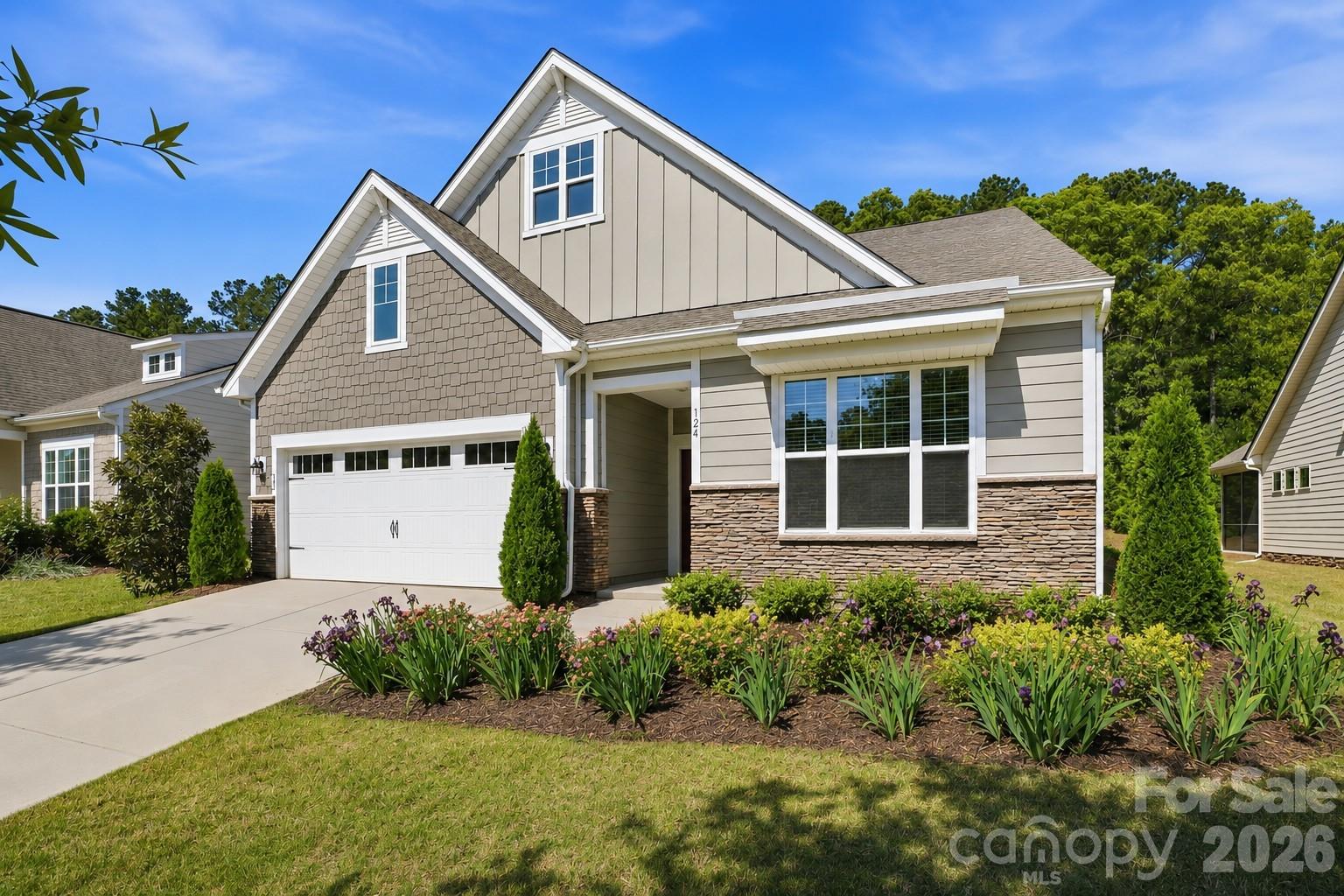 Located in one of the area's premier lakefront active adult communities, this upgraded 4-bedroom, 3-bath home offers luxury finishes, thoughtful design, and low-maintenance living. Designed for both everyday living and entertaining, the open floor plan features engineered hardwood flooring, fresh interior paint (4/2026), crown molding, in-ceiling surround sound, and a spacious Great Room anchored by a sleek linear fireplace that flows seamlessly into the all-season sunroom. The gourmet kitchen is thoughtfully designed with a large center island, gas cooktop, double ovens, stainless steel appliances, quartz countertops, soft-close cabinetry, pullout shelving, and a custom Container Store pantry system. The spacious primary suite serves as a private retreat with a sitting area, direct access to the sunroom, and a spa-inspired bath featuring dual quartz vanities, a glass-enclosed shower, updated mirrors, and custom closet upgrades. Upstairs offers exceptional flexibility with a generous loft, an additional bedroom, and a full bath, making it ideal for overnight guests, hobbies, or a home office. Outdoor living is enhanced by an extended paver patio and a StruXure motorized pergola featuring integrated lighting, ceiling fan, heaters, and a rain sensor, creating a comfortable outdoor living space to enjoy year-round. Additional upgrades include fresh exterior paint (4/2026), a whole-house Generac generator, radon mitigation system, Level II EV charger, Ring doorbell, ceiling fans and blinds throughout, garage storage racks, attic shelving, and nearly 150K in improvements completed by the previous owner. Residents enjoy an exceptional resort-style lifestyle with front and back lawn maintenance included in the HOA, allowing more time to enjoy everything the community has to offer. With more than 60 clubs, social groups, and volunteer opportunities, there's something for every interest. Nestled along Mountain Island Lake, Imagery offers a peaceful, wooded setting with walking trails, a library, fitness and yoga facilities, pottery, textile and art studios, game rooms, beautifully appointed gathering spaces, tennis and pickleball courts, dog parks, resort-style pools, kayak storage rentals, and a full calendar of events led by a dedicated Lifestyle Director. A community marina is in the final planning stages and is expected to offer annual boat slip leases and personal watercraft launches, further enhancing the lakefront lifestyle. Conveniently located just minutes from shopping, dining, I-485, Charlotte Douglas International Airport, Uptown Charlotte, and major medical facilities, this community offers the perfect balance of tranquility and convenience. Please see the attached feature sheet for a complete list of upgrades.