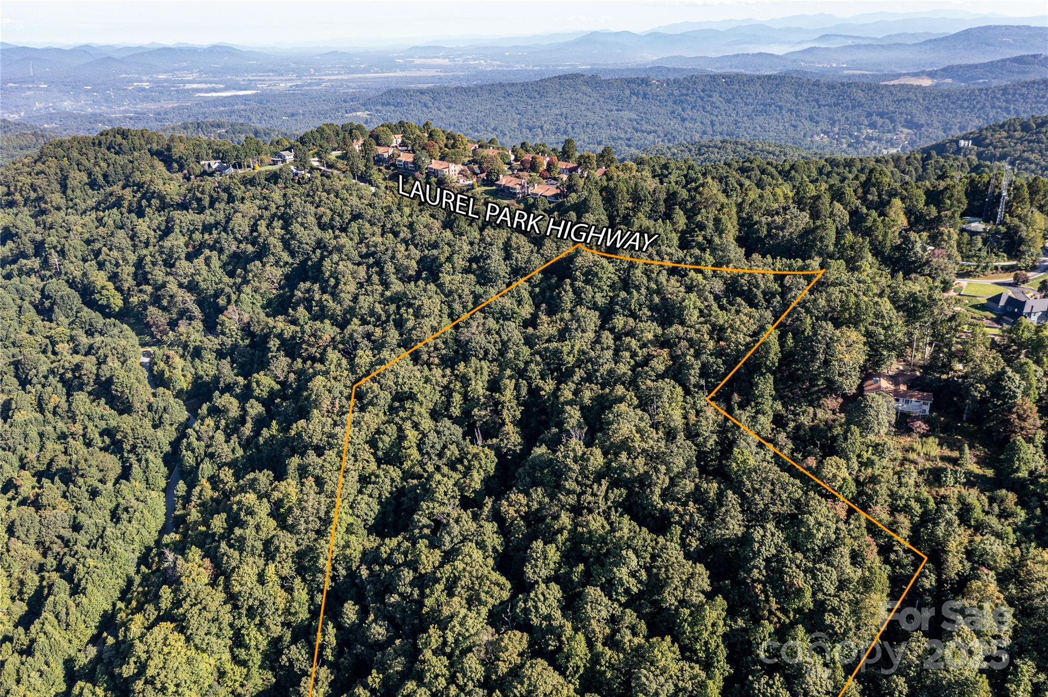 8+ Acres in upper Laurel Park. Long range views year round. very short distance to Jump Off Rock. Possible to be split into 3 home sites or just one estate.