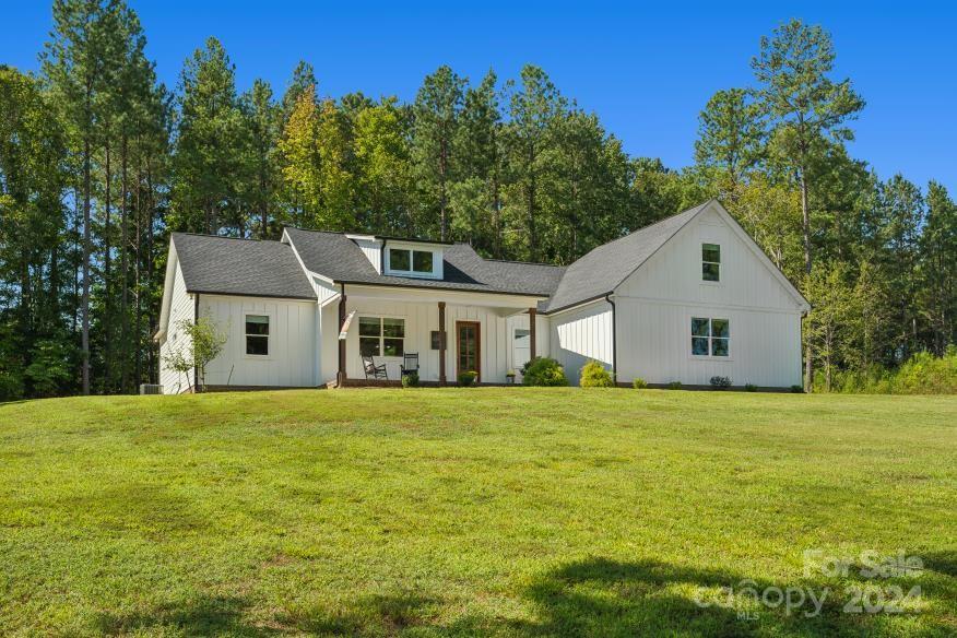 Looking for a well-maintained, immaculate custom built home in a great neighborhood? Look no more! This beautiful home boasts three bedrooms, two full bathrooms, laundry room, kitchen, living and dining space on the main level. A finished room over the garage with another full bathroom gives you additional space and options. Gorgeous custom upgrades (trim, fixtures, fans, windows, front door) throughout the home! Lots of floored attic storage as well. The perfect rocking chair front porch overlooks a large front yard. All of this on a 1.26 acre lot with plenty of trees. Make this your home sweet home!