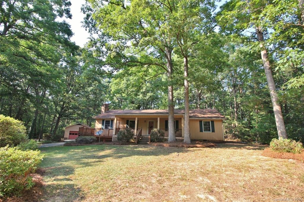 It’s time to put your HGTV and Pinterest addictions to good use! Get creative! With a little love, paint, and new carpet, you’ll have a dream home.  This is a super floorplan with large living spaces, hardwood floors, nice sunroom, big deck and a beautiful rocking chair front porch overlooking 5 picturesque acres with historic trees. The 2 car detached garage has 4 indoor/outdoor dog kennels.