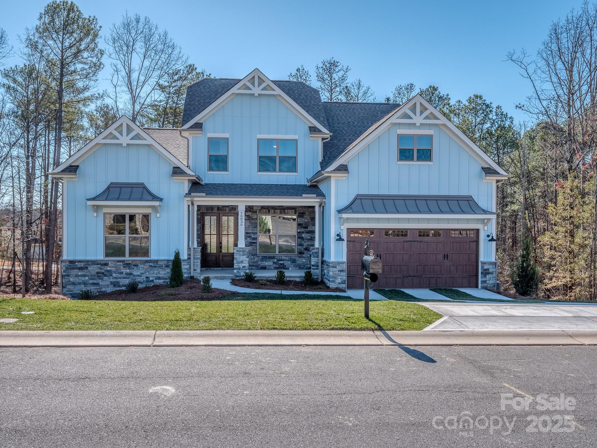 Seize the rare opportunity to build your forever dream home on one of the last remaining dockable waterfront homesites in Tega Cay—with no HOA fees. Perfectly nestled on a quiet cul-de-sac and surrounded by majestic hardwoods and custom luxury residences, this property offers the perfect balance of serenity and sophistication. 
The PROPOSED Taylor plan is a thoughtfully designed floor plan showcasing an open-concept main level with a spacious great room and gas fireplace, a private study, a gourmet kitchen, and a covered deck—ideal for entertaining or relaxing with lake views. The main-floor primary suite offers convenience and comfort, while the upper level features three bedrooms, two baths, and a large bonus room. The finished basement adds exceptional versatility, complete with a second living area, bedroom, kitchen, dining space, and an optional home theater or fitness room. Enjoy lakefront living at its finest—wake to the gentle sounds of the water, fish or swim in your protected cove, and explore the open waters of Lake Wylie just moments away. Home plan and features can be modified by builder to your taste.  Tega Cay offers an exceptional lifestyle with award-winning schools, golf courses, recreation fields, pool, tennis, and a country club, all within a vibrant community setting. This isn’t just a homesite—it’s your opportunity to create a lifetime of cherished lakefront memories.