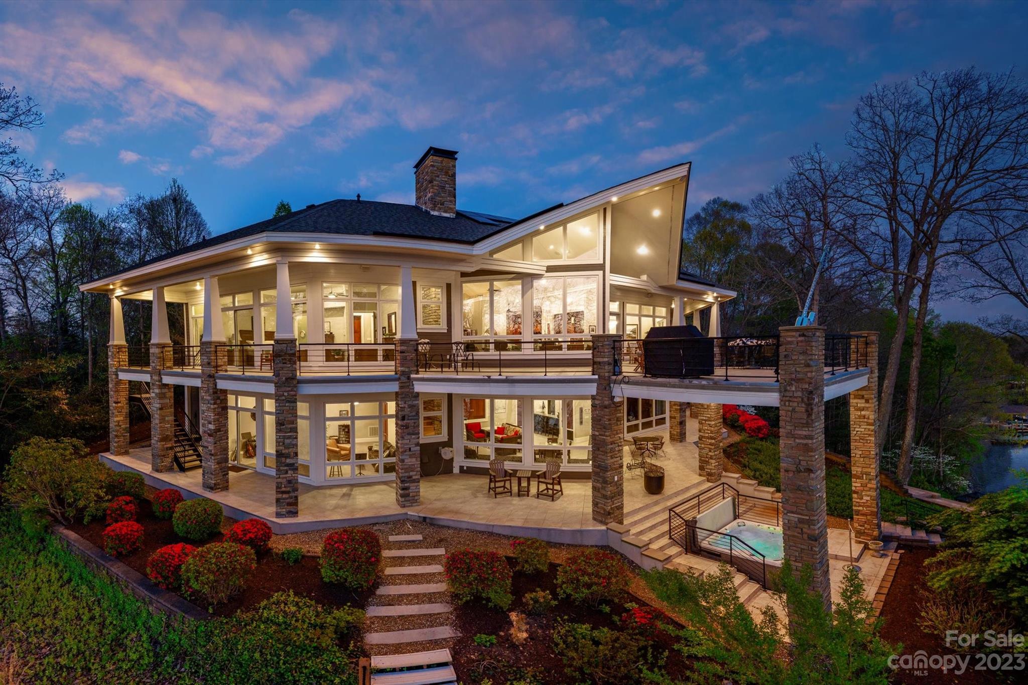 This Windemere Island estate offers an idyllic retreat for peace & serenity in a gated paradise. Inspired by the designs of legendary architect Frank Lloyd Wright, home features unparalleled views of the lake. Arrive through the porte-cochere entrance to be greeted by mahogany doors that lead you into the open & comfortable living spaces. Finishes are exquisite w/ 8' solid cherry doors, Tennessee fieldstone accents, custom cabinetry & extensive millwork throughout. Features 2 primary suites, elevator, & lake-level entertainment room w/kitchenette. Both primary suite bathrooms recently remodeled. Deck entrance from every room of the house! New 'state of the art' dock and incline tram remote system installed 2021. Entertain both indoors & out with wrap-around covered terraces over tiled patios, al fresco dining, & cozy waterfront spa. The landscaping has been extensively updated with stone walkways and lake view seating with a firepit. 2020 New roof and passive solar system installed.