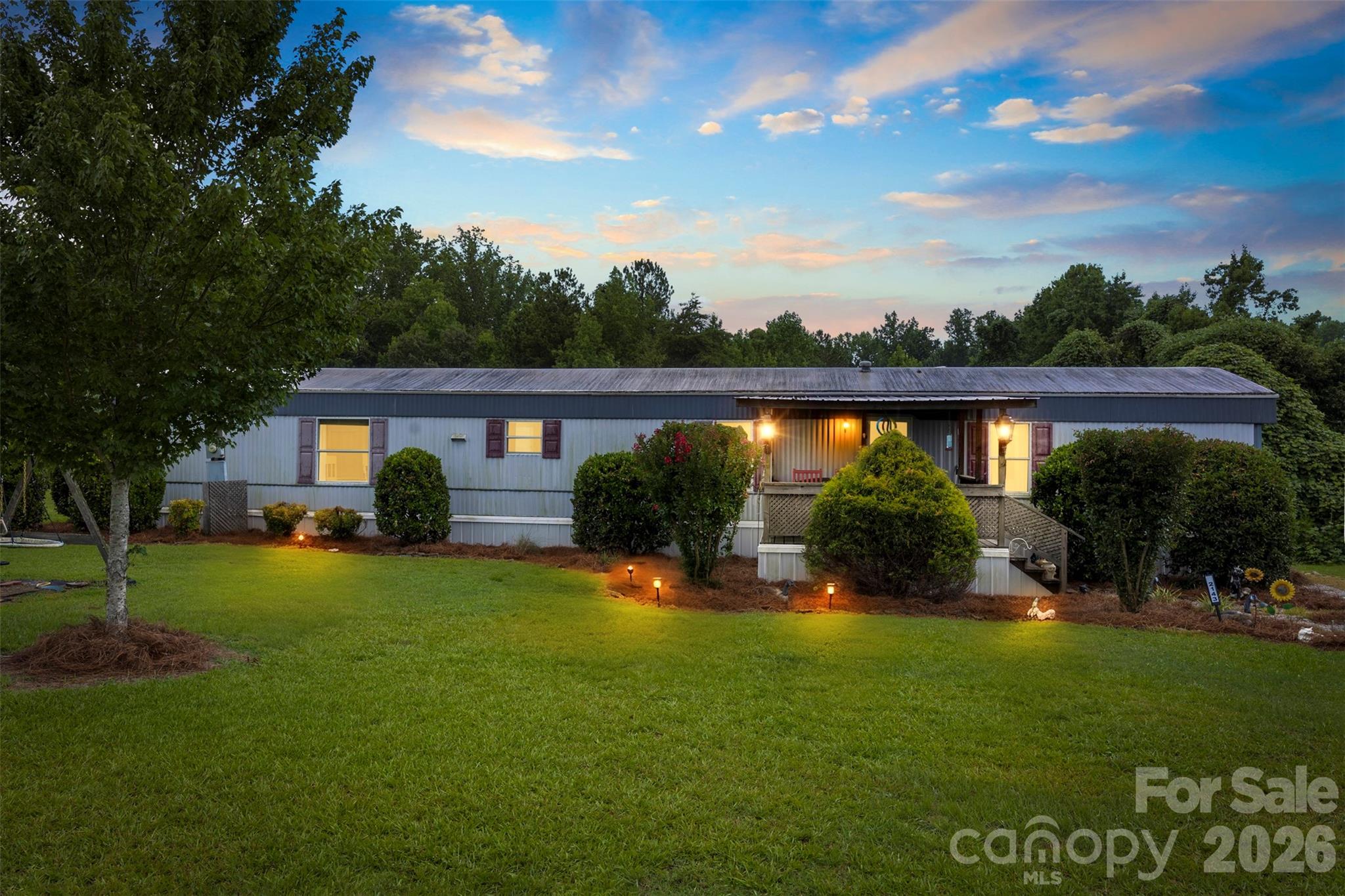 Discover the perfect combination of peaceful country living and room to roam with this charming home situated on 3 beautiful acres. Lovingly cared for by its current owners, this home is ready to welcome its next owners with the same warmth, comfort, and lasting memories. The home has been maintained well with numerous mechanical upgrades made to the property. 

Inside, you'll find a desirable split-bedroom floor plan featuring three spacious bedrooms, two full bathrooms, and generous closet space throughout. The primary suite offers a private retreat with his-and-her closets, dual vanities, a relaxing soaking tub, and a separate shower.

Step outside and enjoy the beauty and privacy of the expansive property. Three 18' x 21' carports provide ample covered parking, storage, or workspace, making this property ideal for entertaining, outdoor hobbies, or simply enjoying the peaceful surroundings.

Recent updates add even more value and peace of mind, including a whole-house water filtration system, DBA I-Foam closed-cell spray foam insulation beneath the home, and a new well pump and pressure tank installed in 2022, complete with a transferable 10-year warranty.
