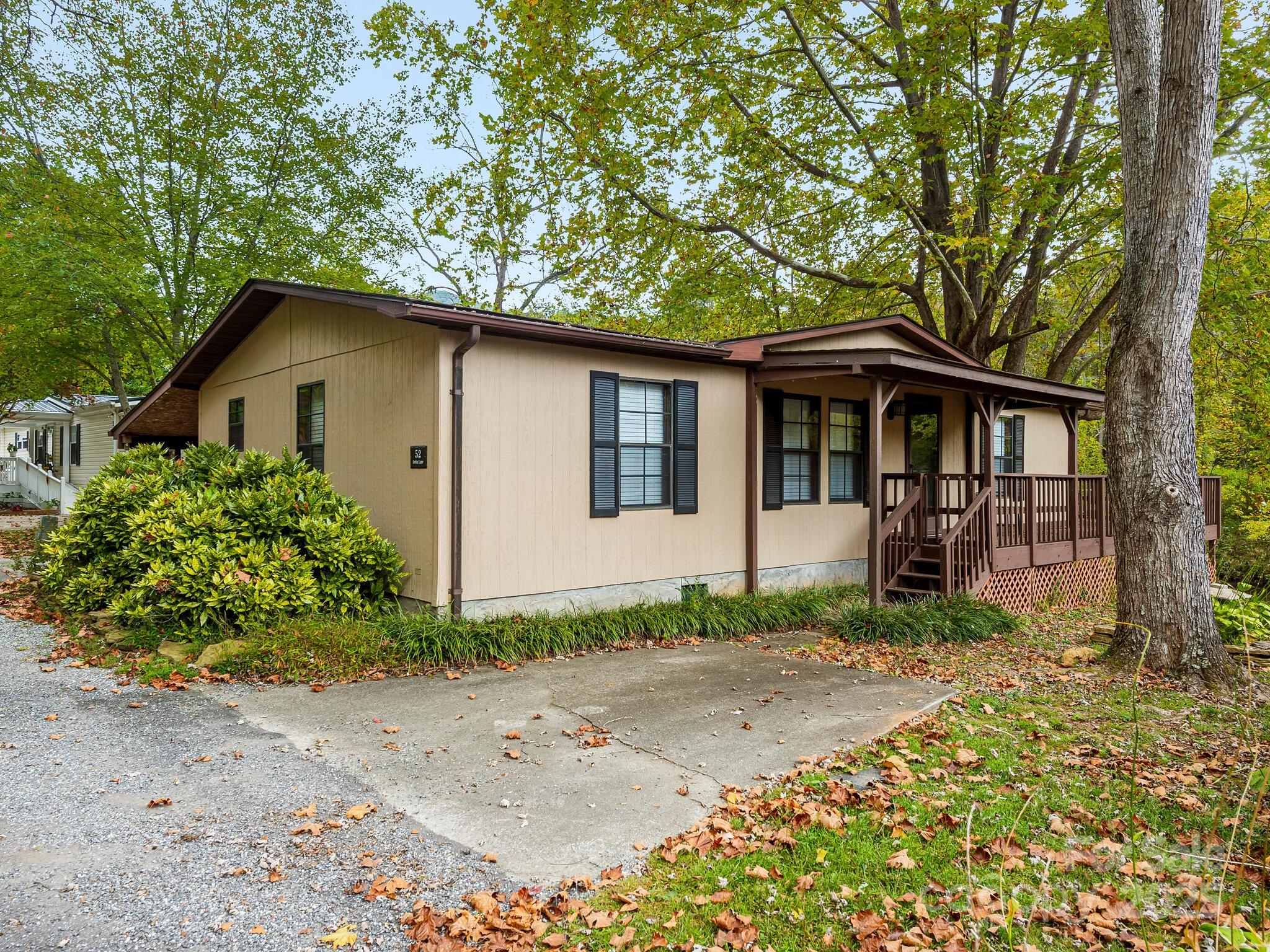 What a dream location for this fabulous mountain escape, right in the heart of beautiful Cullowhee, North Carolina! Live here part time or full time, either way, you will enjoy a peaceful experience watching the river flow gently by! Bonus: this beautifully remodeled one level home comes nicely furnished, and is move-in ready! Choose to take a class or two at Western North Carolina University or catch live music on Main Street, Sylva. Shopping is a dream at the lovely shops, and the restaurants and coffee shops are plentiful. This thriving area is the perfect combination of peaceful living, and close by activities. No damage from Helene! Many amenities included in low HOA fee!