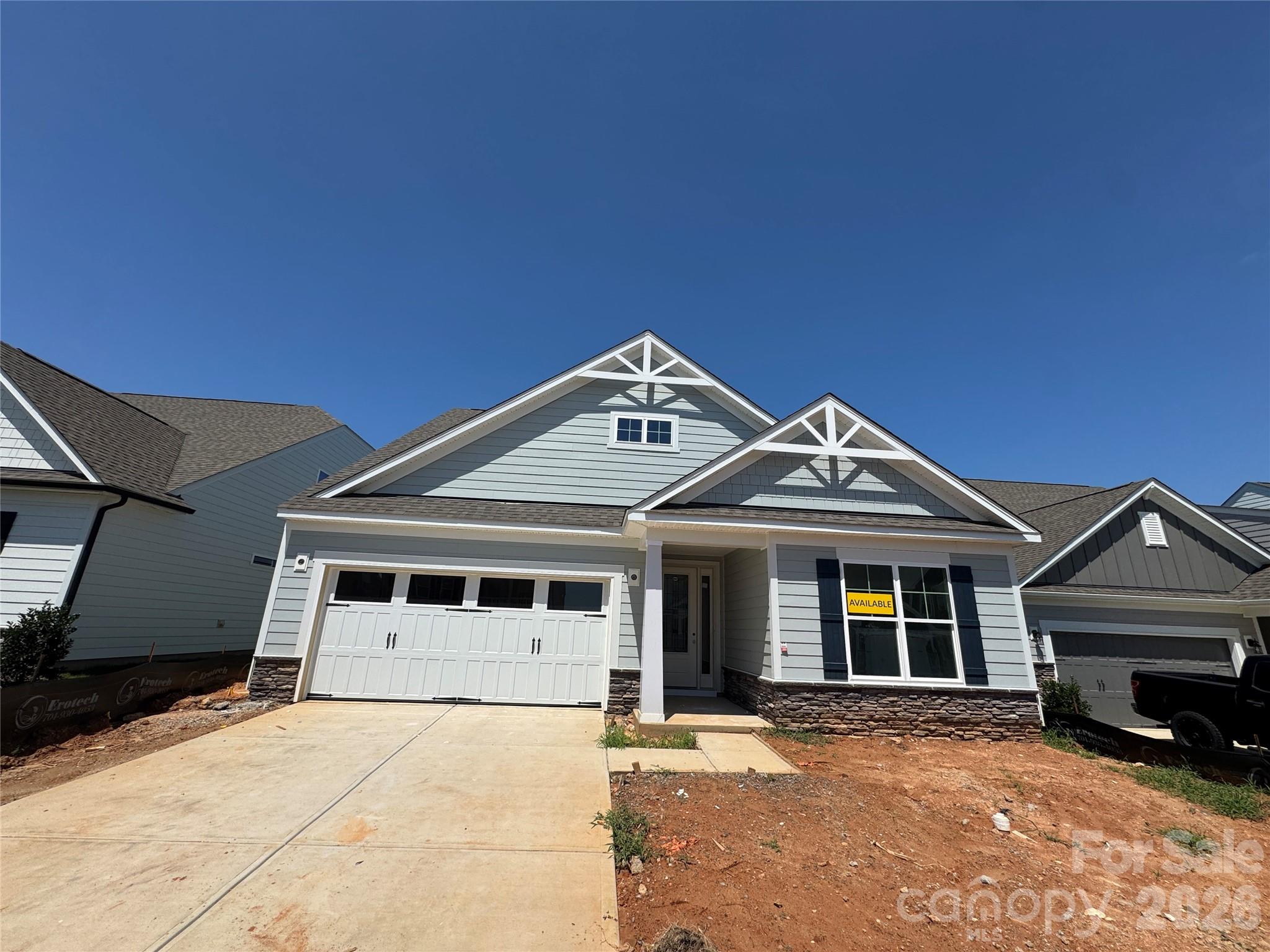 Welcome to Laurelbrook a brand-new construction amenity-rich community less than two miles from Lake Norman! This thoughtfully designed 1-story Fenwick floor plan offers 3 bedrooms, 2 baths, and more than 1,700 square feet of living space. The open-concept kitchen features upgraded painted cabinetry, quartz countertops, designer tile backsplash, stainless Frigidaire Gallery appliances, a farmhouse sink, and a large island. The private primary suite includes a tiled shower with semi-frameless door, rain shower, dual vanity, quartz countertops, and a spacious walk-in closet. Enjoy the outdoors on the covered rear porch with an outdoor living package firepit with bench wall, perfect for relaxing or entertaining. Community amenities include a pool, cabana, pickleball courts, and pocket parks. Schedule your tour today!