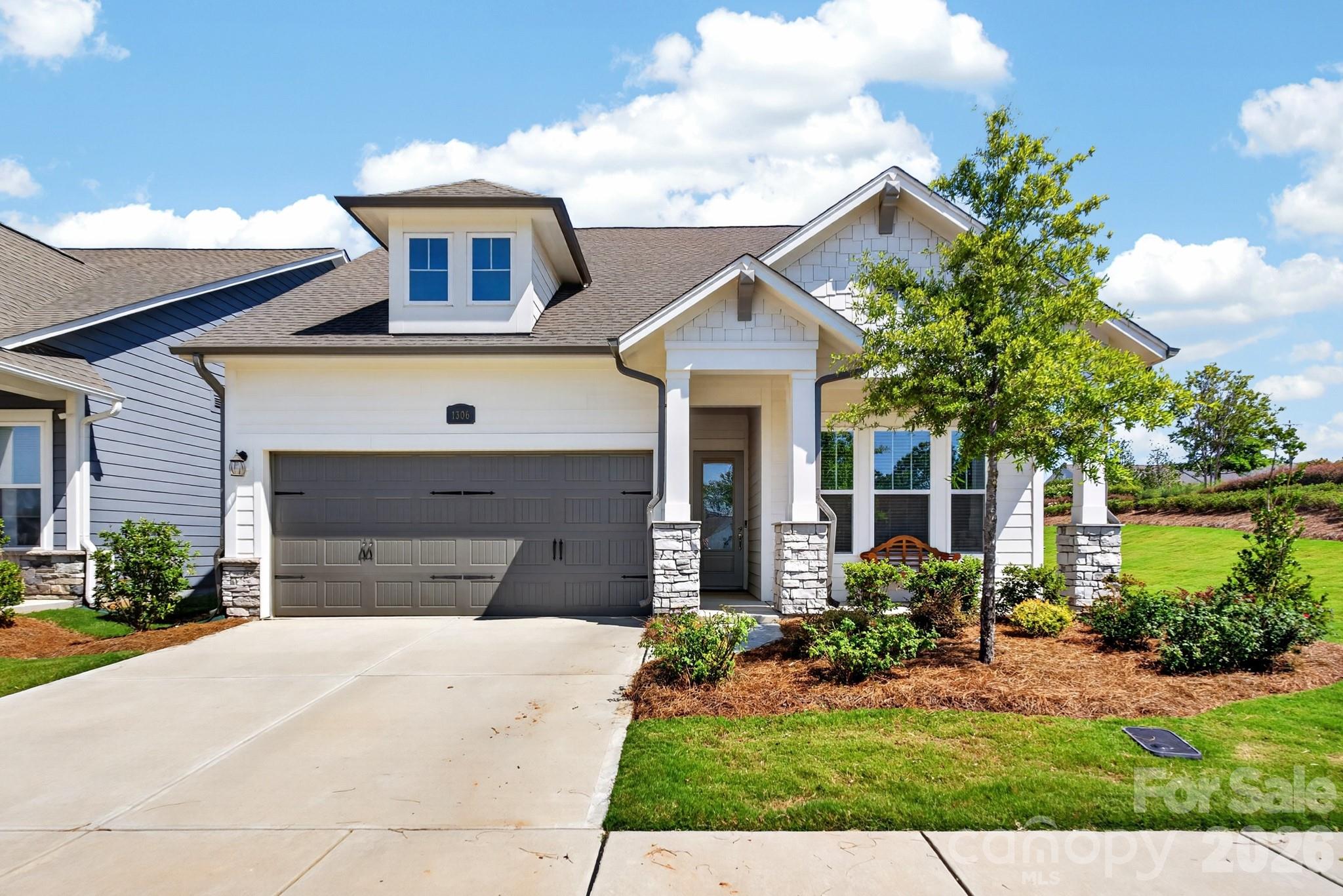 Welcome to 1306 Idyllic Lane in the esteemed 55+ community of Encore at Streamside. This stunning single-story home beautifully combines comfort with style, featuring 3 spacious bedrooms, 2 full bathrooms, and 1852 square feet of inviting living space. The heart of the home boasts an open and airy layout, perfect for entertaining friends or enjoying quality family time, enhanced by ample natural light. Step outside to the spectacular rear covered porch ideal for relaxation or alfresco dining. Situated in the sought-after area of Waxhaw, the home offers convenient access to shopping and recreational activities. With its contemporary design, high-quality finishes, and desirable features, this residence is truly a must-see.