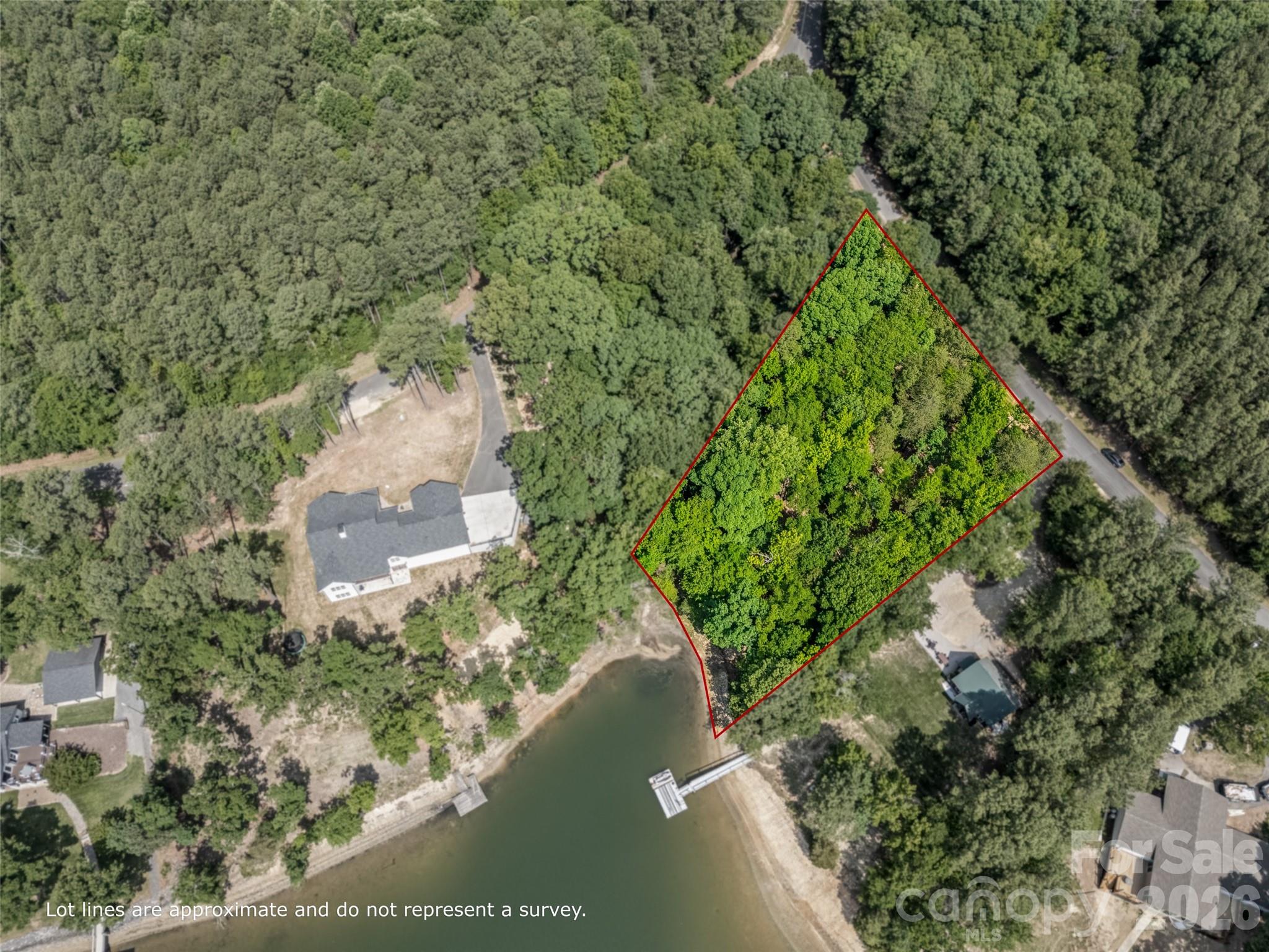 YOUR WATERFRONT DREAM STARTS HERE — BUILDABLE LOT ON LAKE WYLIE WITH NO HOA!
Tucked into a quiet cove on nearly an acre of in the award-winning Clover School District— already perc'd for a 4-bedroom home and ready for your vision. This is a blank canvas with no timeline pressure and no one telling you what to build or how to build it. Bring your own builder and design the custom home you've always imagined.
Situated directly on the water; 120 ft of shoreline, this .85-acre lot offers the kind of lakefront lifestyle most people only dream about right from your own shoreline and enjoy daily access to Lake Wylie's 13,400-acre playground for boating, fishing, and everything in between. While a dock is not currently permitted, preliminary conversations with Duke Energy suggest a permit may be obtainable — giving you even more long-term potential to maximize this waterfront setting. Approximately 8-10ft of water at full pond. 
The surrounding area features large wooded parcels that keep the landscape peaceful, private, and naturally protected. All of this serenity sits just 30–35 minutes from Charlotte Douglas International Airport, with easy access to area hospitals, dining, shopping, and entertainment.
Low York County taxes. Clover Schools. No restrictions. Waterfront. This one checks every box.