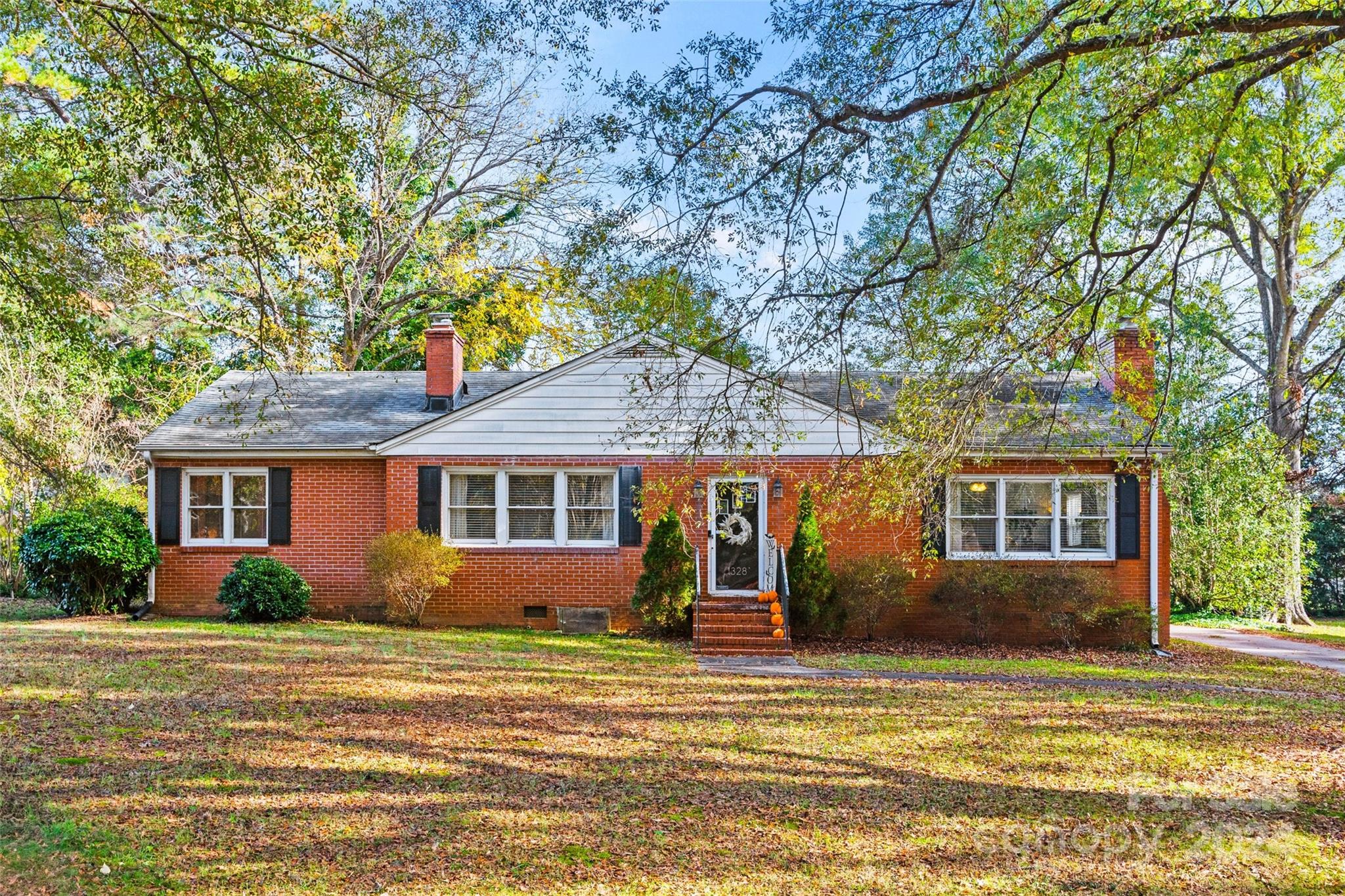 Charming, well-maintained full brick home on a spacious, fenced lot! This property offers cozy vibes & timeless features such as beautifully refinished hardwood floors, an open concept layout, large, private backyard, & ample parking. Enjoy the convenience of a detached carport with a screened-in area and extra storage space - leave it as is or put on your own personal touch.  Located in a quiet neighborhood with no HOA, you'll have peace and privacy while being just minutes away from grocery stores, schools, healthcare facilities, and easy interstate access. Don’t miss this gem—your perfect blend of comfort and convenience awaits!
