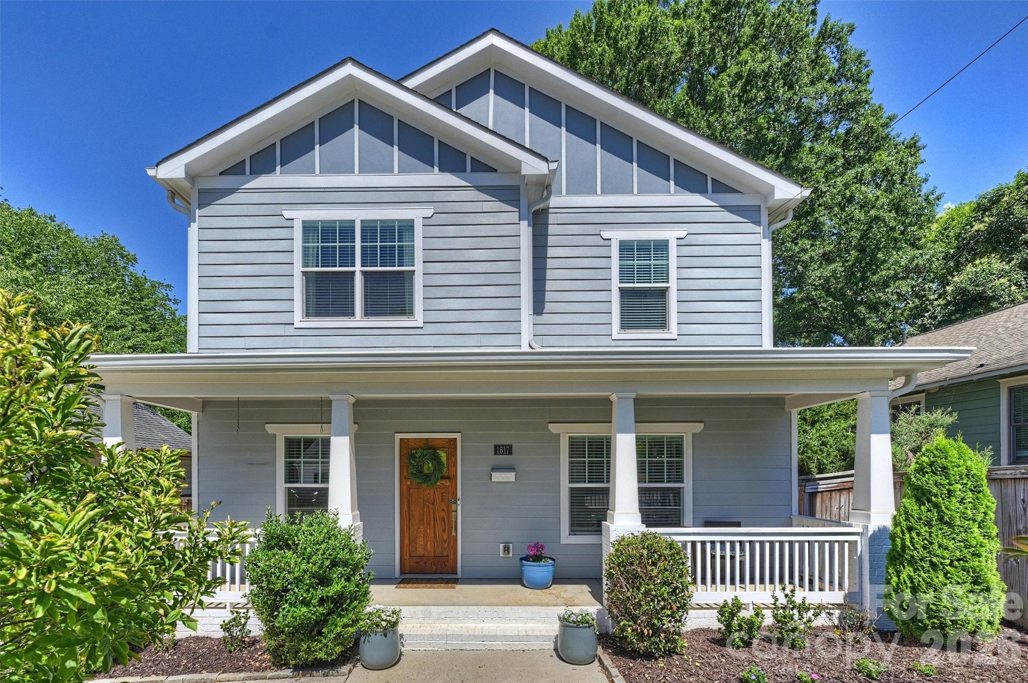 Welcome to 1617 Hawthorne Lane, a stunning newer-construction home that perfectly blends timeless charm with modern convenience in one of Charlotte's most vibrant and sought-after neighborhoods. This exceptional property places you in the heart of the Belmont/Plaza Midwood area, where you can truly enjoy the pulse of the city.

From the inviting rocking-chair front porch to the beautifully crafted interior, this home exudes warmth and character. The open-concept floor plan is ideal for both everyday living and entertaining with spacious Great Room that flows seamlessly into Kitchen and Breakfast Area .  Gourmet Kitchen features huge work island , leathered granite countertops, 5 burner gas range plus walk in pantry with "Closets by Design" built ins. New refrigerator and dishwasher in 2024. The main level also offers a Guest Bedroom, Full Bath and a versatile Office or Playroom highlighted by exquisite shiplap walls.

Upstairs, the spacious Primary Suite serves as a private retreat with a large walk-in closet and decorative trim accent wall.  Luxurious spa-inspired Bath boasts dual quartz vanities, seamless glass walk in shower and private water closet.  Two additional 2nd level Bedrooms share a large Jack-and-Jill Bathroom, providing functionality and comfort for family or guests.

The outdoor living spaces are equally impressive. A newly sodded, privacy-fenced backyard with an automatic gate creates a secure and secluded setting for relaxation and entertaining. Enjoy gatherings on the Deck overlooking paver patio. 

Adding tremendous flexibility and value is the detached garage with a beautifully finished accessory dwelling unit (ADU) completed in 2024. Featuring a Full Kitchen and Queen sized Murphy bed, this versatile space is ideal for overnight guests, a nanny suite, private home office, fitness studio, or income-producing opportunity. Garage has amazing storage constructed by "Closets by Design"!

Step outside your front door and walk to neighborhood favorites like The Culture Shop and Two Buck Saloon, while enjoying easy access to Plaza Midwood's eclectic restaurants, breweries, coffee shops, and local boutiques. Commuters will appreciate the nearby streetcar connection to Uptown Charlotte, along with quick access to major hospitals, employment centers, and everything the city has to offer.