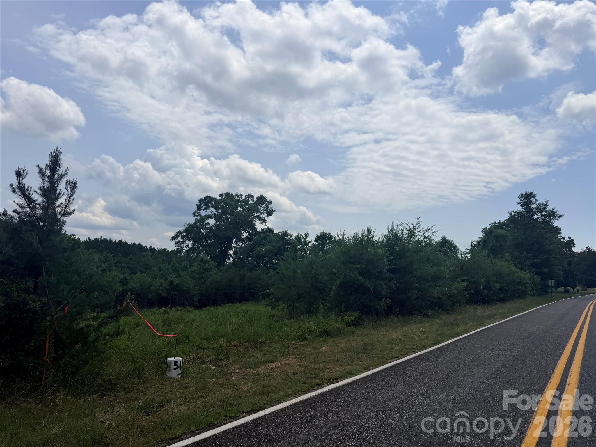 UNRESTRICTED 1.5 Acre tract just 10 minutes from Walmart. This great laying tract is a great place to put in a homestead. Mobile homes welcome. Offered at $45,000.