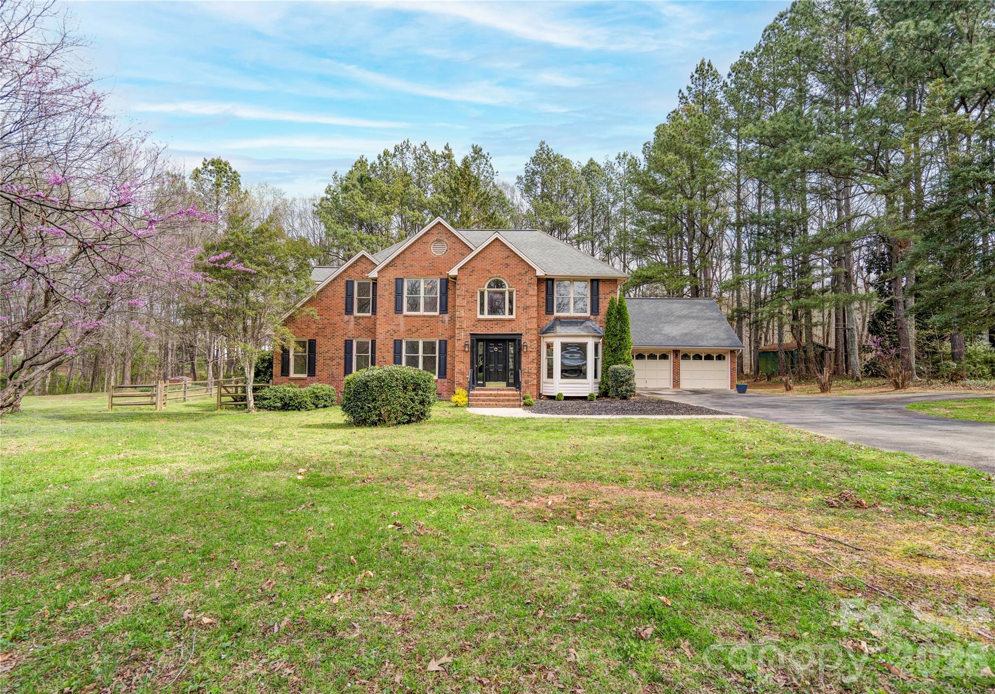 Waiting for you this home features 4 bedrooms and 2.5 baths.  There is approximately 2.03 acres.  The main level has a primary bedrooms and bath along with a powder room.  The family room has a rock fireplace and there is an eat-in kitchen plus dining and living.  The upper level has 3 bedrooms and a bath.  The home is nestled in the cul-de-sac location and the bath yard is wooded offering privacy for back yard entertaining.