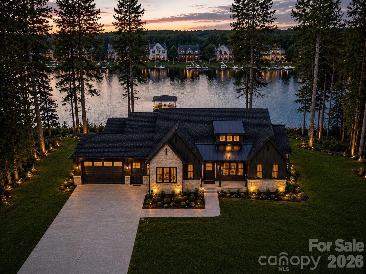 Stunning Custom Ranch with Basement on Waterfront Lot — No HOA!
This custom-built home offers exceptional craftsmanship and thoughtful design throughout. Enjoy lake living with your own private dock and the freedom of no HOA restrictions.
The main level features an open floor plan ideal for entertaining, showcasing a gourmet kitchen with custom cabinetry, quartz countertops, and top-of-the-line appliances including a 48" smart commercial-style gas range with 6 burners, electric griddle, true convection oven, a 30" side-by-side refrigerator, and a 30" side-by-side freezer. 
The spacious primary suite includes a luxurious bath and an oversized walk-in closet, along with 2  secondary bedrooms conveniently located on the main level.
Step out to the covered back deck overlooking the water — the perfect spot for morning coffee or evening sunsets.
The lower level offers even more space with two additional bedrooms, multiple flex rooms, a large great room, and a full bar area complete with refrigerator, sink, and quartz countertops — ideal for hosting and entertaining.
A total of four garage spaces — a three-car side load garage plus an additional frontload one-car garage — provide ample room for vehicles, storage, or car enthusiasts.
Every detail has been carefully curated by a professional designer with selections that are truly too numerous to list. This home blends elegance, functionality, and comfort in a serene waterfront setting.