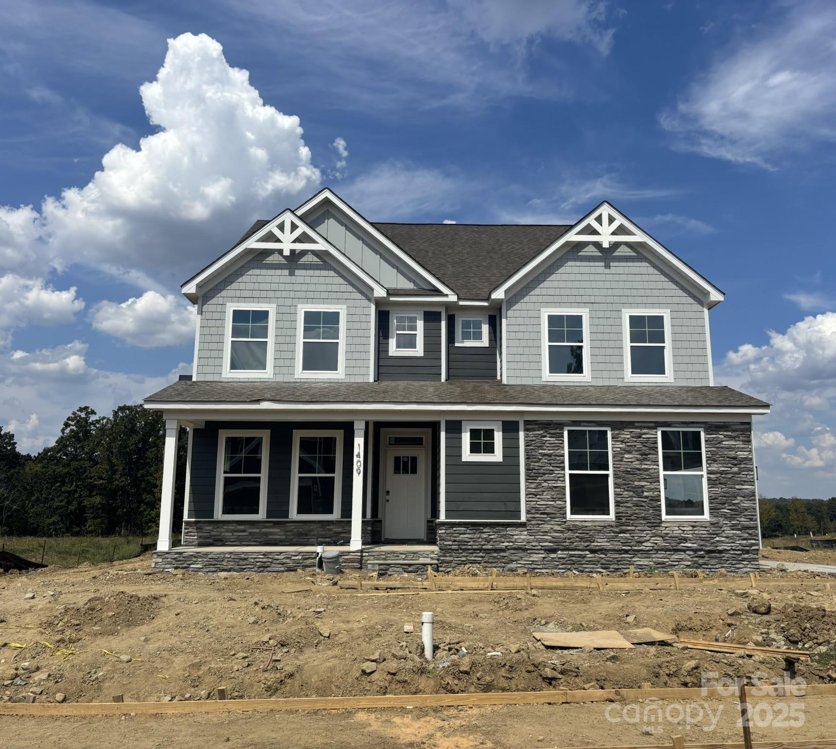 Welcome to a brand-new community, close to Catawaba River!  This 3-story Davidson plan has 5 bedrooms, 4 bath. The primary bedroom features a sitting room. The main level features a large kitchen with a butler's pantry to the dining room. The kitchen has designer 42 inch cabinets, white quartz counters, tile backsplash & stainless appliances including a gas cooktop and a wall oven. The 2nd floor includes the primary suite, along with 2 additional bedrooms and bathroom. 2nd floor also has a loft. The primary bathroom features a luxury shower with tile, separate sinks, water-closet & access to large walk-in-closet. 3rd floor bedroom and bath has also been included. Other exciting features in this home include colonial trim, metal stair balusters, a cosmo fireplace with shiplap wall with black slate surround, quartz countertops in all baths, a single basin kitchen sink, & more! Patio features a covered porch!