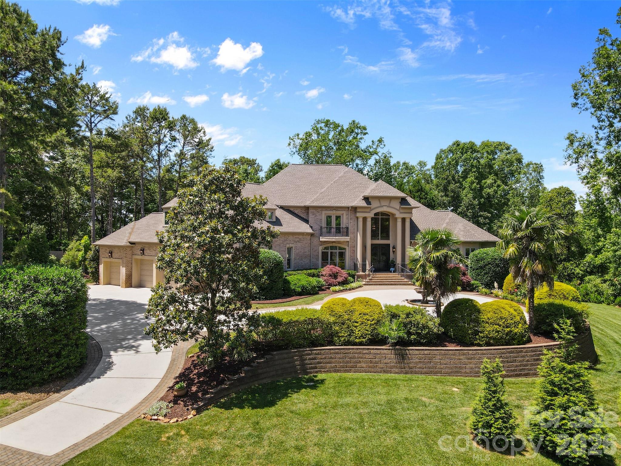 1405 Saratoga Woods is a stunning estate on 1.78 acres in a private gated community offering 8,630 sqft of luxurious living. Crafted w/ exceptional quality, it features an open floor plan, soaring wall-to-ceiling windows & high-end finishes. Main-level primary suite is a retreat w/ a sitting area, see-through fireplace, &
walkout terrace w/ panoramic views of the manicured grounds. The
gourmet kitchen includes a large center island, Thermadore appliances, &
seamless flow into the living & dining areas. Upstairs offers 3 ensuite
bedrooms, one w/ a private terrace overlooking the courtyard fountain.
The finished walkout basement includes a full second kitchen, cozy living
room w/ fireplace, gym, movie theater, office & an additional ensuite
bedroom—ideal for multigenerational living. W/ a spacious 4-car garage
and thoughtful design throughout, this home delivers unmatched lifestyle
and value. Simply cannot be built today at this price. High Speed Fiber Internet Available!