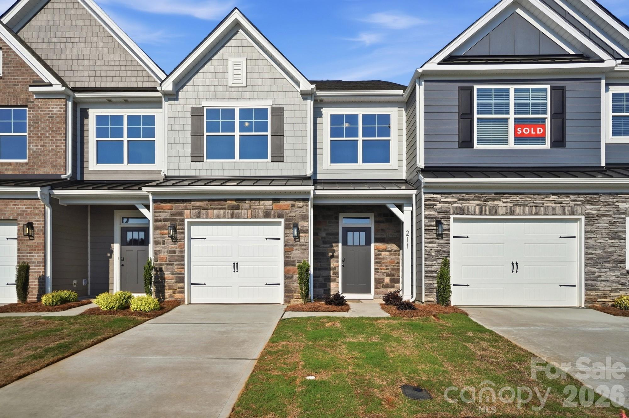 This Ashland plan has 3 bedrooms, 2.5 baths, and more than 1,800 square feet of living space. Enter the home through the foyer with tray ceiling, Craftsman-style trim, and a convenient, beadboard drop zone to see the open kitchen, dining area and family room that walks out to a covered porch. The kitchen features white, Shaker-style cabinets and white quartz counters, a spacious island, tile backsplash, and stainless appliances, including a gas range and microwave. The open main floor has beautiful and durable Enhanced Vinyl Plank flooring throughout. Stairs with composite treads and metal balusters lead upstairs to the loft, bedrooms, full baths and laundry room. The primary bath has a tiled shower with bench seat & semi-frameless door, dual-sink vanity, and linen closet. The upstairs full bath has a tub/shower combo. All baths have white cabinetry and white quartz counters. Walking distance to shops, eateries, and other conveniences. Visit today!