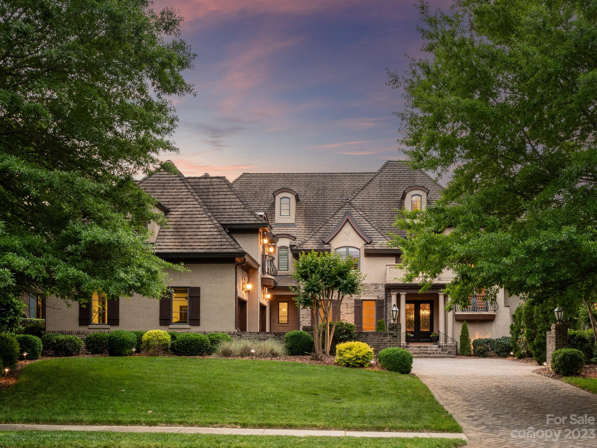 Stunning luxury estate with panoramic golf course views located in sought after gated Longview Country Club.  Enjoy your private 18-hole Jack Nicklaus course with world class amenites including clubhouse, restaurant, tennis, fitness, pools and youth lodge.  This floor plan is everyone's favorite, but so hard to find.  Primary suite and guest suite on the main level at opposite ends of the house.  Bright, light dream kitchen built for entertaining a large group with Wolf, Sub-Zero and Bosch appliances. Oversized kitchen island opens to 2-story keeping room with juliet balcony and wall to wall windows. You'll love the impressive paneled office / music room with soaring celings and elegant dining room with built in bulter's pantry.  Ride the elevator or choose from 2 stairways to 4 upper level en-suite bedrooms, 2 bonus rooms, 2nd laundry room and flexspace.  Enjoy evening sunsets and pond views from your covered patio with wood burning fireplace and built in grill or screened in porch.