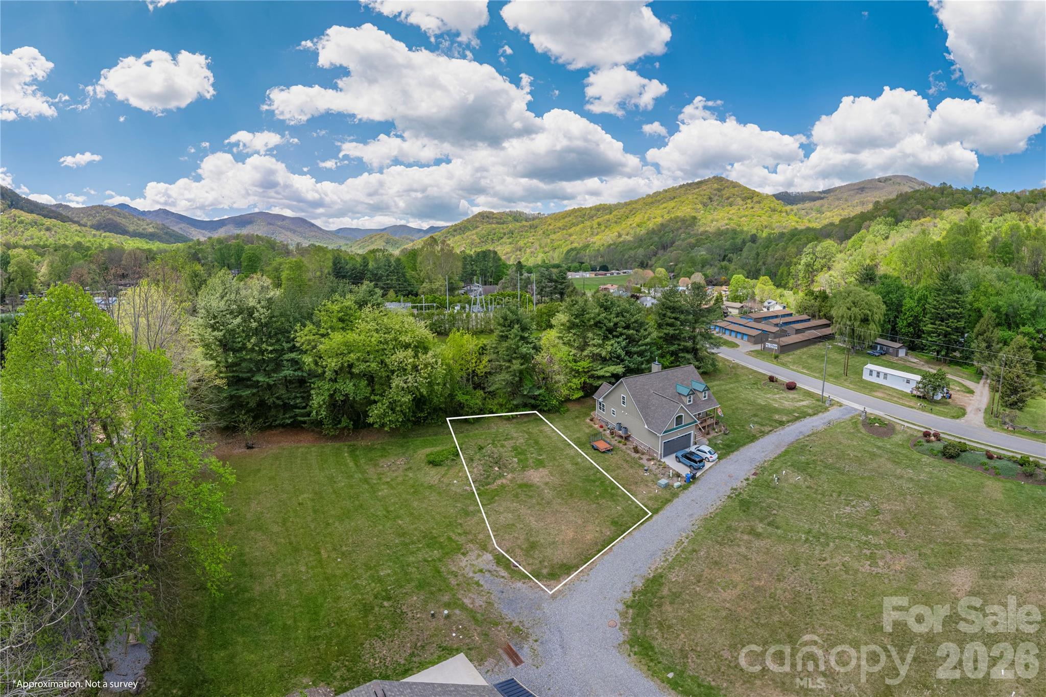Tucked into the heart of Maggie Valley, this inviting homesite offers an exceptional opportunity to enjoy the best of mountain living. Featuring level, ready-to-build terrain and captivating year-round views of the surrounding mountains, it’s an ideal setting for your vision to come to life. Outdoor enthusiasts will love the easy access to nearby hiking trails, waterfalls, and scenic drives along the Blue Ridge Parkway. Just steps away, the neighborhood fishing pier provides a perfect spot to relax and unwind, while golf cart access to Maggie Valley Country Club adds to the property’s charm. With a peaceful atmosphere and convenient proximity to Waynesville’s dining, shopping, and entertainment, this location blends comfort and accessibility. Well-suited for a full-time home, a mountain retreat, or a short-term rental investment.