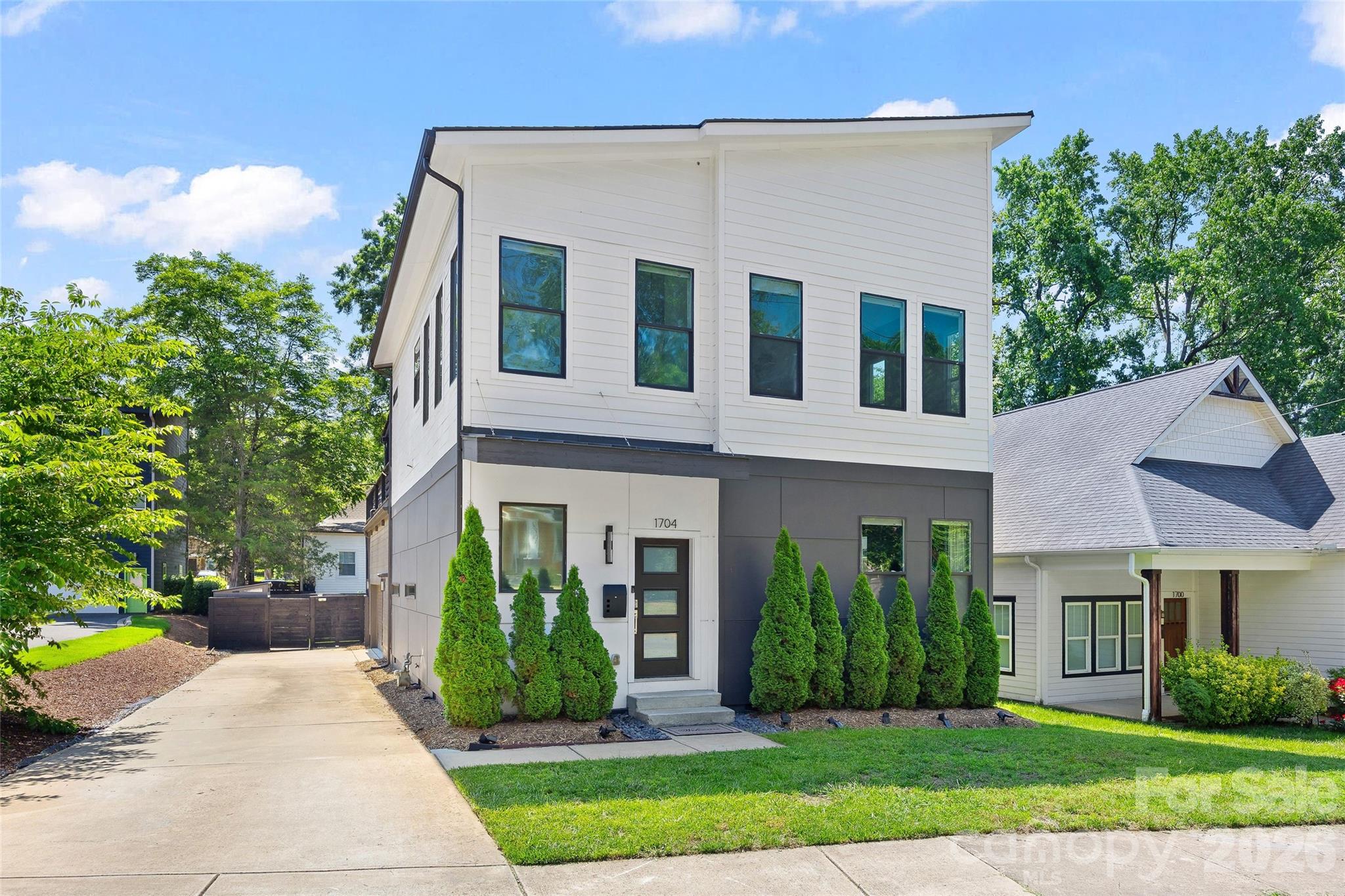 Welcome to 1704 Pegram, where indoor comfort and outdoor living come together beautifully in the Belmont neighborhood. The bright open floor plan centers around a sleek kitchen featuring a large island, abundant cabinet space, and seamless flow into the main living area.  A first floor bedroom and full bath provide flexibility for guests, while an additional flex room works perfectly as a home office, or whatever you choose! Upstairs features a spacious primary suite, an additional light-filled bedroom, updated bathrooms, and a versatile nook creating another potential work-from-home space or the perfect reading spot.  Further, the fully fenced backyard is designed for entertaining and everyday enjoyment, featuring a lower deck that offers the perfect spot for morning coffee or evening unwinding. And it leads you to the expansive upper deck, just made for dining and entertaining friends, or relaxing in a hammock or two.  Additional highlights include an attached two-car garage, new roof in 2024 and HVAC in 2023. Located less than a mile from Optimist Hall and Plaza Midwood, with quick access to NoDa and Uptown, 1704 Pegram has everything you want and need!