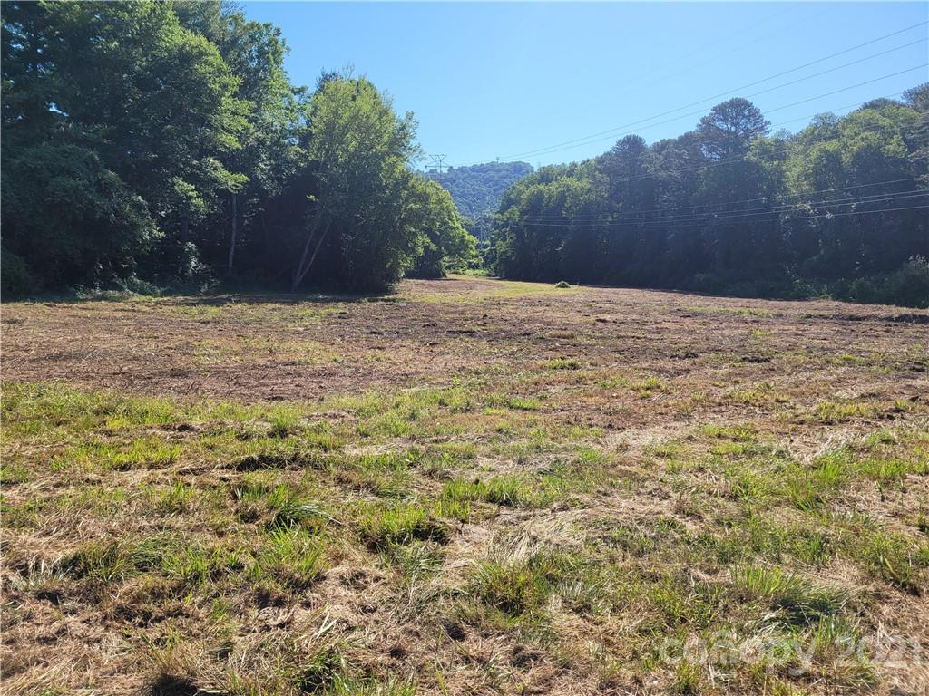 At 5.64 acres, this property is one of the larger open pieces on land on busy Hendersonville Rd in South Buncombe County.  Located very close to the Asheville Airport, I-26, the Blue Ridge Parkway and Biltmore, this property would be an excellent location for your business if you are looking for visibility and convenience.