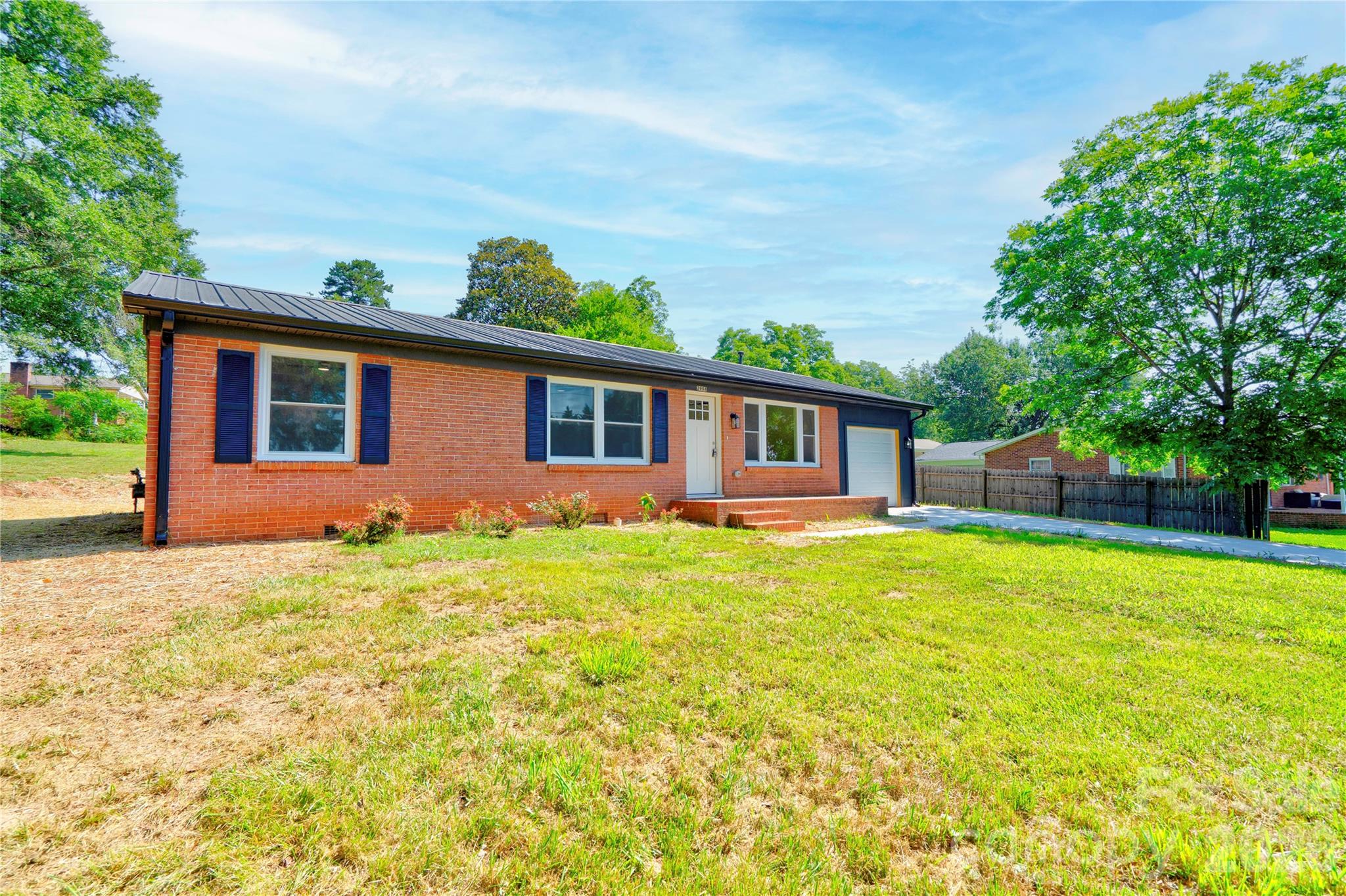 Beautifully remodeled and move-in ready, this brick ranch proves you don't have to choose between location and updates. Tucked away on nearly half an acre, this home offers the space you want while keeping you less than 5 minutes from Target, Sam's Club, Hidden Valley Mall, restaurants, and everyday conveniences.
Inside, you'll find a bright, modern interior highlighted by a stunning kitchen featuring new cabinetry, updated countertops, stainless appliances, and a fresh, cohesive design throughout. All appliances convey (including the refrigerator, microwave, oven and dishwasher) so you can move right in and start enjoying your new home from day one. Thoughtfully renovated with permits pulled, this home also features a tankless water heater, a single-car garage, and the peace of mind that comes with quality improvements already completed. Whether you're relaxing at home, entertaining friends, or enjoying the convenience of being close to everything Hickory has to offer, this property checks all the boxes.