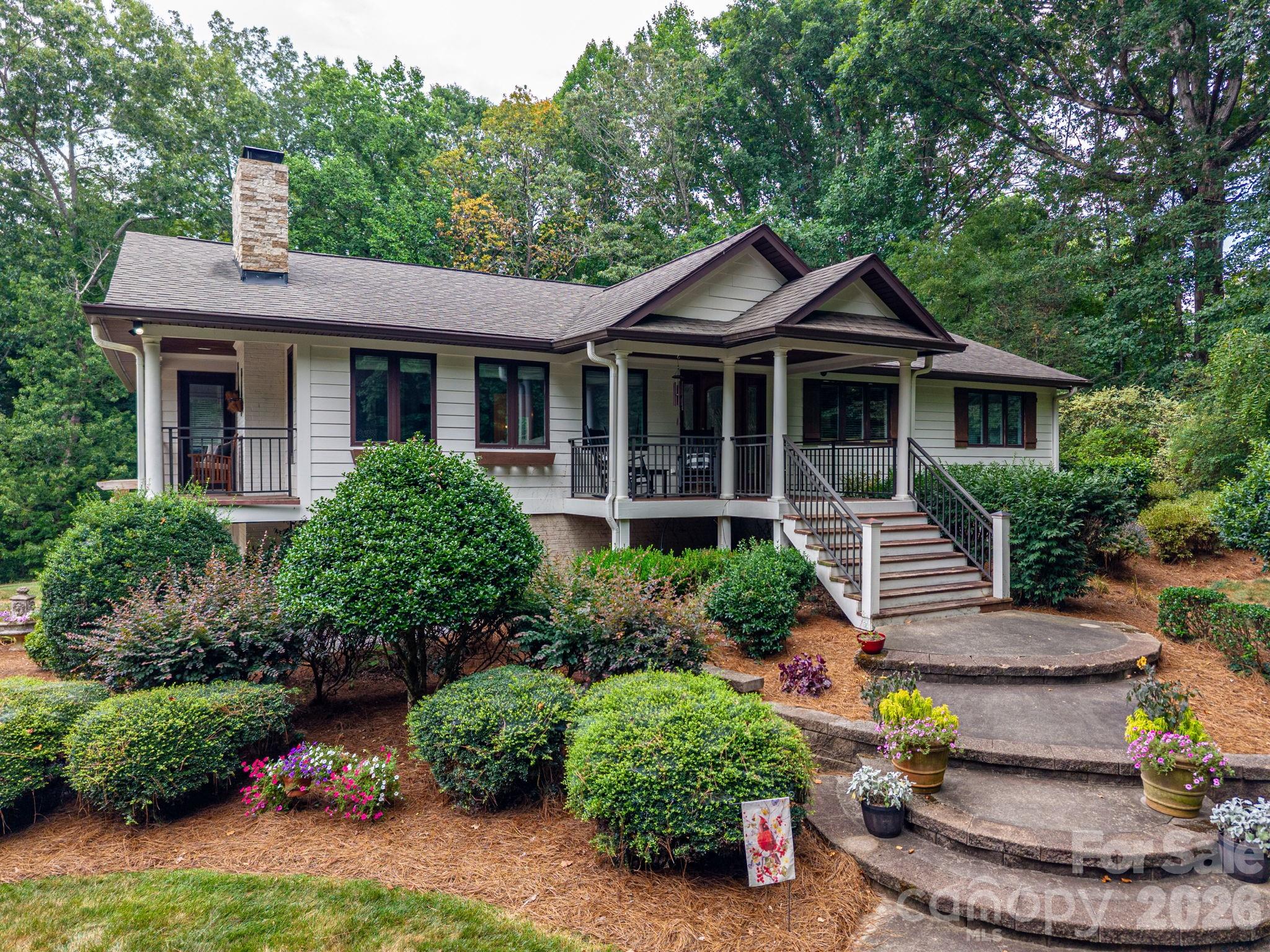 Welcome to 2206 Hillside Drive, a truly one-of-a-kind property offering exceptional space, flexibility, and privacy on a beautifully wooded and landscaped 2.72-acre lot.

The main level features an updated kitchen, spacious living room, dining area, a versatile flex space perfect for a home office, playroom, or den, and three generously sized bedrooms. Thoughtfully designed for both everyday living and entertaining, the home offers plenty of room for family and guests.

The fully finished basement expands the possibilities with its own private living quarters, featuring a primary bedroom, full kitchen, living area, and 1.5 bathrooms. Whether you're looking for the ideal setup for multi-generational living, extended guests, or potential rental income, this separate living space offers incredible versatility.

Enjoy the peaceful surroundings from the welcoming covered rocking chair front porch, relax on the side balcony just off the living room, or unwind on the covered rear deck overlooking the expansive, private backyard surrounded by mature trees.

One of the property's most impressive features is the incredible 2,500+ square foot detached three-car garage. More than just a garage, this amazing space also serves as an indoor basketball court. Upstairs, you'll find a heated and cooled entertainment level complete with a movie room, full bar, and an oversized flex space that can be customized to fit your lifestyle—whether it's a home gym, game room, office, studio, or additional recreation area.

With its unique layout, endless possibilities, and private setting, 2206 Hillside Drive is a rare opportunity to own a home that truly has something for everyone.