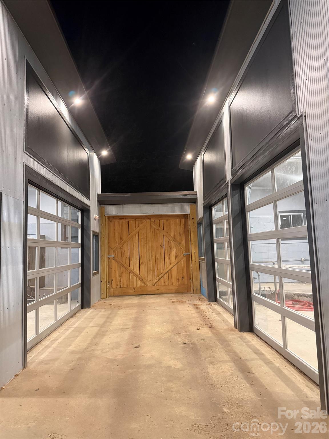 Fully renovated mixed-use property on the Gateway to  Asheville’s River Arts District and Biltmore Village.   
 Located at the corner of Amboy Road and State Street, directly across from Carrier Park and the French Broad River Greenway, this site offers exceptional visibility 12,000+ cars daily—and quick access to I-26 (less than ½ mile). Amboy Road links Biltmore Village, the River Arts District, and West Asheville’s thriving neighborhoods, forming one of the city’s most desirable recreational and commercial corridors.
Main Level Features:
• Inviting bar space with covered patio and serving window NEW exterior seating the ( Bench Fence)  
• Central courtyard separating bar from café/kitchen area
• Rear sections include 16’ ceilings, three glass garage doors, raised floor area
        Exterior features include open patio, boulder circled fire pit and creekside yard, Plenty of parking
• Excellent natural light and flexible layout for events or dining 
Upper Level Features:
• Commissary kitchen with 3-bay sink, hand sink, dry storage, cooler areas, staff bath,
 Chef’s office, 
Additional Highlights:
• Zoning: River - Mixed-use / commercial
• New Certificate of Completion
• Ample onsite parking with easy access
• NNN lease | Subdividable | Flexible terms available 
This property is ideal for a bar, café, food service venture, or creative mixed-use concept. With minimal build-out remaining, it’s ready for immediate occupancy—allowing operators to focus on their vision rather than construction.
Built to last, steeped in local history, and poised for its next chapter—this property offers the perfect stage for Asheville’s next great concept.