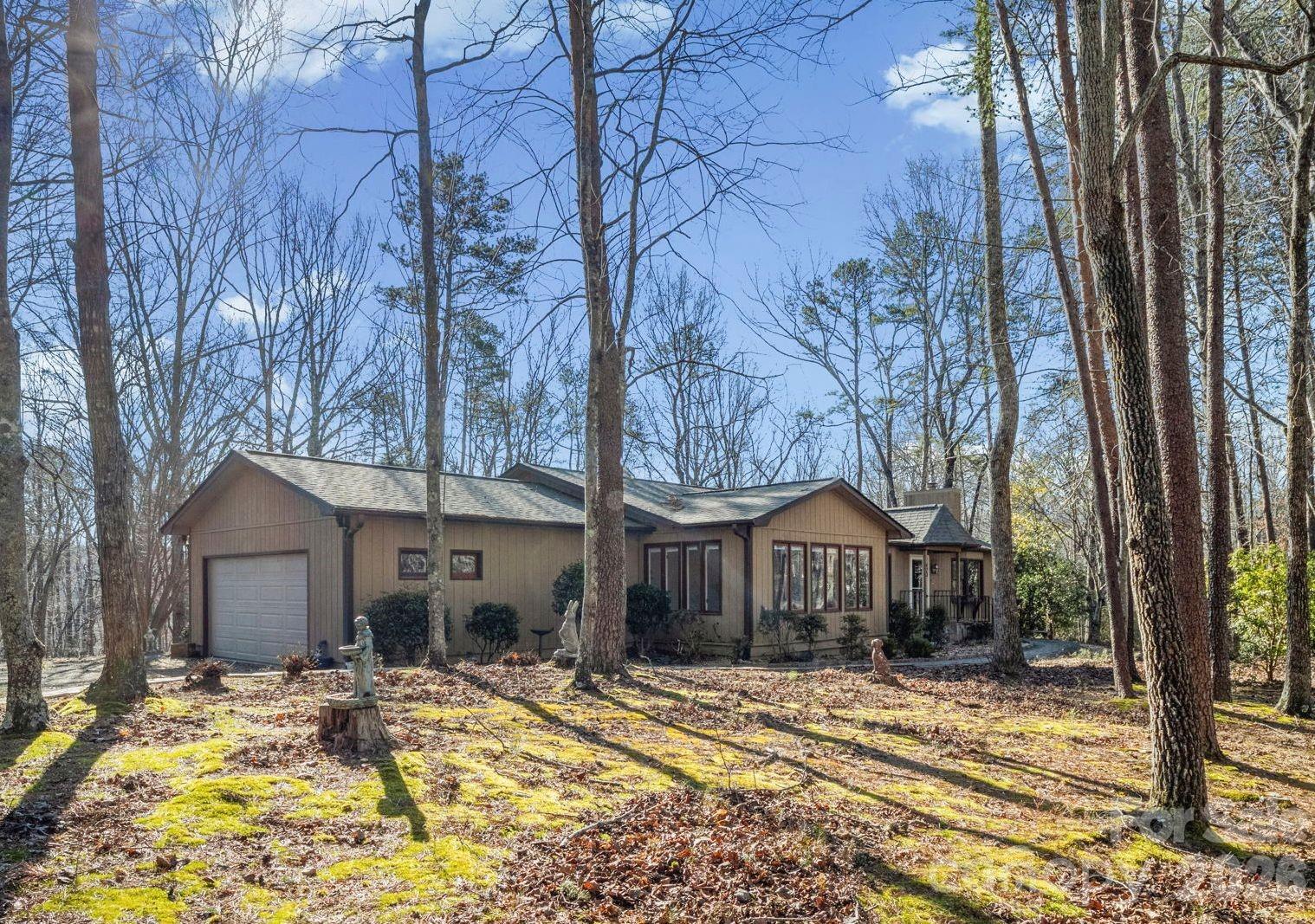 You’ll fall in love with this beautifully updated home in sought-after Morgan Chapel Village. Thoughtfully designed with all living spaces on one level, this residence offers both comfort and style with gorgeous wood and tile flooring throughout.
The spacious living room centers around the stone fireplace with gas logs. The attractive kitchen has been tastefully renovated with new granite countertops, a stylish tile backsplash, tile flooring, and stainless steel appliances. An adjoining breakfast nook provides a charming dining space and easy access to the deck. In addition, the formal dining room has ample space for family gatherings. 
The primary suite offers a large walk-in closet and a fully renovated private bath complete with a walk-in shower and double vanity. Two additional bedrooms provide flexibility for family, guests, or a home office, while the second fully renovated bath features a heated jetted tub for a spa-like retreat.
A generous family room adds even more living space, perfect for entertaining, hobbies, or a media area.
Situated on a private 1.02-acre lot surrounded by natural woods, the property also features a fenced backyard. Known for its spacious homesites, wooded surroundings, and peaceful atmosphere, Morgan Chapel Village offers a rare combination of privacy and convenience.