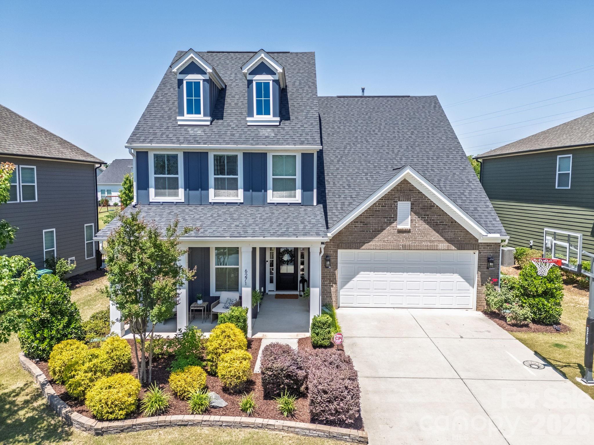 Stylish design meets everyday function in this cul-de-sac home in one of Fort Mill’s most sought-after communities—Masons Bend, located along the Catawba River just south of Charlotte.
Built in 2020, this thoughtfully designed 4BR/3BA home is wrapped in charm, with a welcoming covered front porch that opens into a bright, functional floor plan. Designer finishes, custom built-ins, and upgraded light fixtures add personalized touches throughout.
Set on a beautifully landscaped, level lot with a screened porch, this home offers comfort and the Masons Bend lifestyle.  All of this on a landscaped Level lot with screen porch. The main level features a Guest suite with FULL bath, Stunning Formal dining, light-filled breakfast area and a spacious family room. The focal point of the home is the GORGEOUS gourmet kitchen: includes a 5-burner gas cooktop, wall oven, island, farm sink graced with abundant countertops, white tile backsplash, pantry and Stainless Steel appliances. Upstairs, the luxurious Primary suite feels like a retreat with sunny sitting area perfect for wellness space. The spa-like bath has dual vanities, glass enclosed shower, modern finishes and OVERSIZED walk-in closet with custom shelving. Two additional bedrooms, a Full bath, and Loft/Bonus room provide plenty of space for family and guests. Enjoy outdoor living on the screened porch that overlooks level backyard. The oversized 2-car garage offers space for your golf cart to complete this exceptional home. Masons Bend residents enjoy amenities including a clubhouse, pool, playgrounds, fitness center, and access to the Catawba River with kayak/canoe launch and the Carolina Thread Trail for hiking and biking. Top-rated Fort Mill schools—like Kings Town Elementary—located within the community. Conveniently located near shopping, dining, and Uptown Charlotte, this home offers the best of luxury living in a vibrant community. Golf carts are welcome and the preferred transportation to school and amenities.