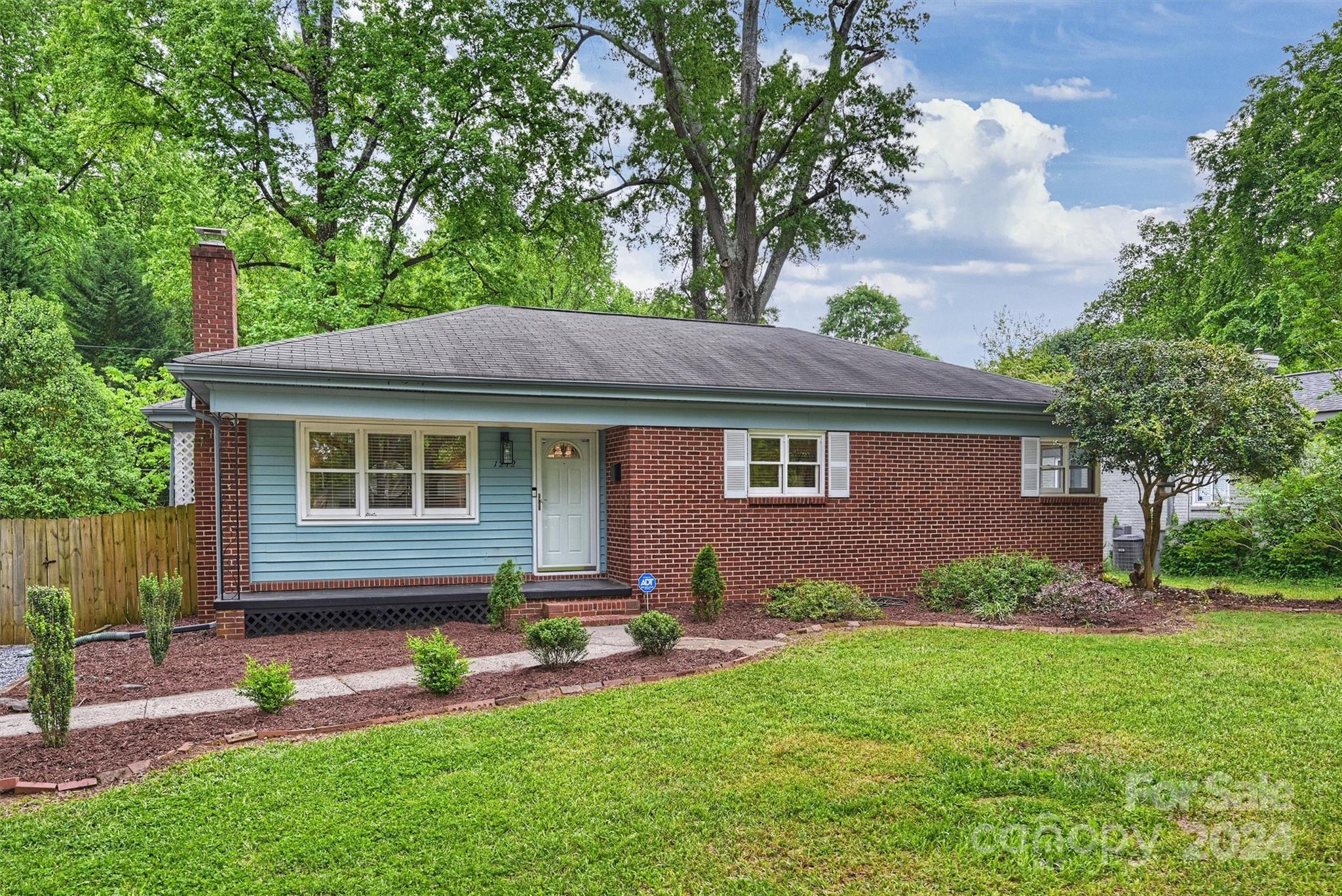 This beautifully renovated home sits on a well landscaped  lot that backs up to Evergreen Nature Preserve, guaranteeing a quiet and private setting, well within the heart of the neighborhood. The floor plan offers a nice living room with a fireplace and neat shelves surrounding it, a spacious dining room and a kitchen with a side entrance. The kitchen had craftsman-style white cabinets, granite counters, and a new floor. The primary bedroom is spacious with good closets. The bath has white tile and cabinetry and the entire house is freshly painted. The hardwood floors are in excellent condition. There is a brick patio and the privacy fence has a gate by the driveway. There is updated lighting and door hardware, and the interior was freshly painted in 2024. New HVAC system in 2022. The exterior is low maintenance with its brick and vinyl siding exterior.