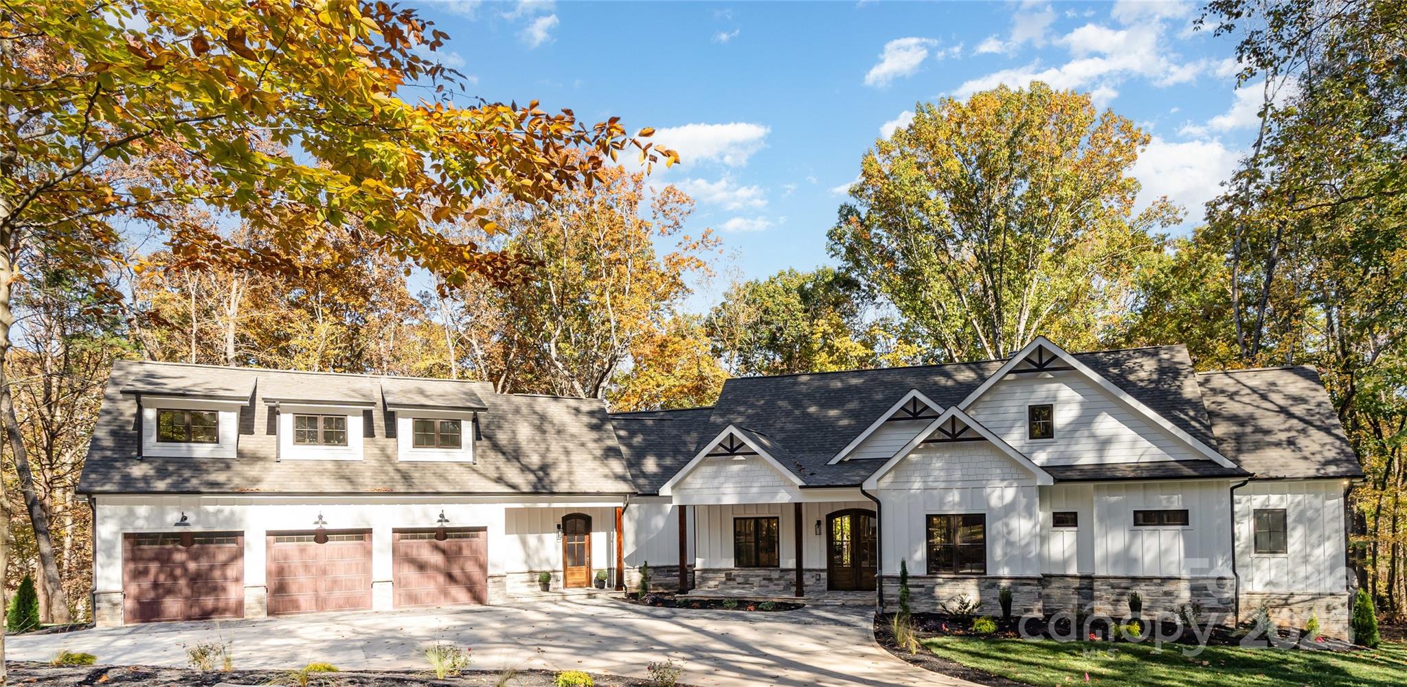 Wow, what a beautiful home in a serene setting on over 2.3acres backing up to over 35 peaceful wooded acres, inside 485 with a truly custom built home that's just minutes from Southpark.  This true Southern gem of a home was meticulously designed and executed by custom home builders.  The sprawling residence features the primary and two other bedrooms on the main floor, along with the expansive kitchen, scullery, dining areas, office/den, mud room/entry area and a real laundry room.  The kitchen is the heart of the home with a full suite of Thermador appls, waterfall Quartz counters, custom range hood, and a large scullery room with additional oven, micro, DW, and storage plus the kitchen has amazing views of the wooded lot behind, the gracious covered back patio that evokes Colorado/Montana with the vaulted wood ceiling and beams that are carried into the main living room stone fireplace and hearths.  The primary suite also includes vaulted ceilings, a custom closet with island is already built-out and the ensuite bath is just dreamy with marble heated floors and steam shower equipped with an aroma therapy option!  The office includes extensive custom moldings and windows overlooking the paver accents of the circular driveway and front yard.  Too many other options to list but the expansive basement must be mentioned!  A nice bar greets you as you enter the fully walk-out basement with covered patio, large play/game rooms, theatre room with insulated walls plus 2 other beds and baths. This is such an amazing entertaining space (also extra storage rooms!).  The back yard is really the "piece de resistance", plenty of room to enjoy a pool & large flat grassy yard with the ultimate in quiet, peacefulness, and serenity.  This home is truly a custom masterpiece and not something easily found in S Charlotte in this location with these great schools and just minutes to some of the best shopping & dining Charlotte has to offer.  Schedule your private tour now!