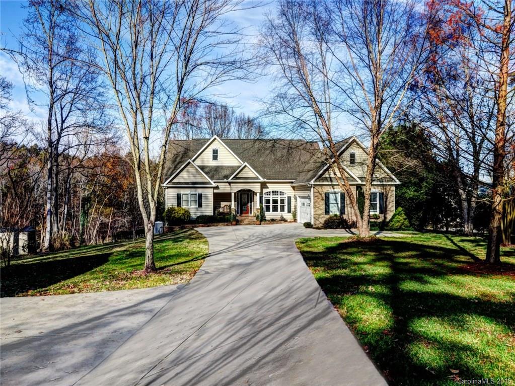 Beautiful waterfront home located on 1.20 acres! Waterfront cove lot w/ floating dock. Enjoy the koi pond, mature landscaping, & lake views on the large patio w/ pergola, screened in porch, or the upper deck! Finished walk out basement w/ rec room, bed & full bath, & additional room. Large bonus over garage. Nice open floor plan for easy indoor entertaining! 2 Story Great room features cathedral ceilings & a gas log fp. Gleaming hardwoods throughout main. Garage space for 4 cars! A must see!