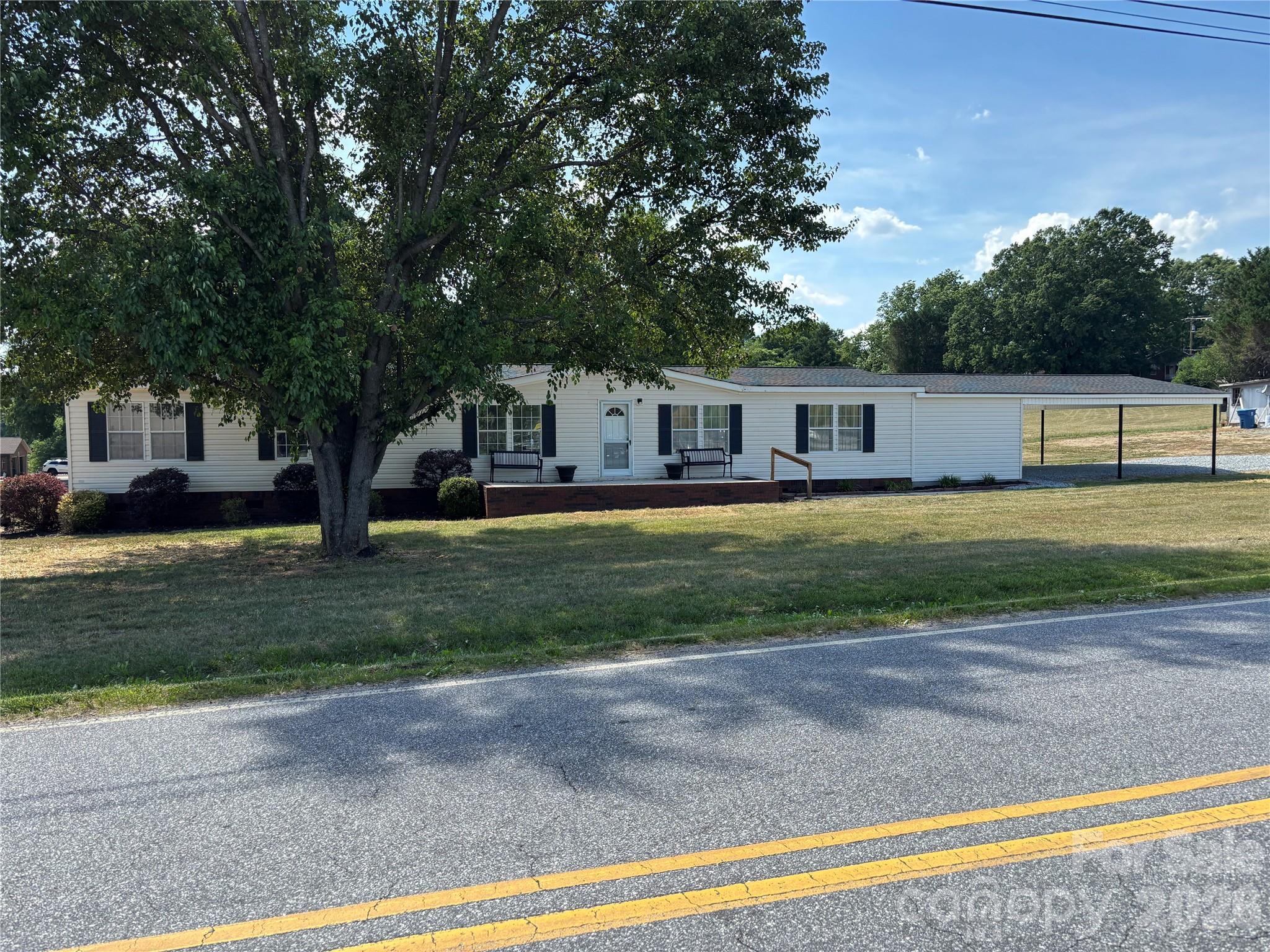 Check out this stunning home with five bedrooms, three bathrooms, and a level lot located in the Town of Taylorsville. This beautiful home has had many updates which include a new roof in 2018, a new HVAC heat pump system in 2024, recently updated bathrooms, new vinyl plank flooring throughout, and a recently fully remodeled kitchen with new countertops, new cabinets, and new kitchen equipment. This home features sheet rock walls and an open floor plan with a large family room for entertaining all your quests. A two-car oversized carport with a large storage room. A rear porch and a rear deck for all your outdoor entertaining. Not another one on the market and this home will not last long.