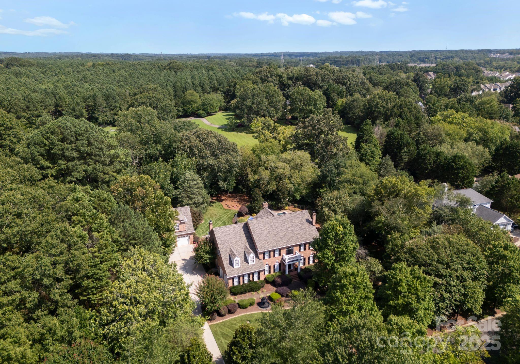 Welcome to your dream home nestled in the picturesque town of Davidson, known for its rich history and vibrant community. This exquisite property sits on over an acre of lush, private land. The outdoor space is a true oasis, featuring a stunning swimming pool surrounded by a spacious sundeck-perfect for sunbathing or hosting summer gatherings.The property boasts a 2 car attached garage as well as a  2 car detached with an apartment above.This versatile space features a Murphy bed and a full kitchen, complete with hardwood floors ideal for guests,an in-law suite,or a rental opportunity.Step inside the main house to discover a warm and inviting interior complete with beautiful hardwood floors and 4 fireplaces!Lower level is perfect for entertaining with a billiards area, wet bar and large screen TV. Located near entry to Greenway and just 1 mile from downtown , with its perfect blend of historic charm and modern conveniences, this home is truly a gem in Davidson.