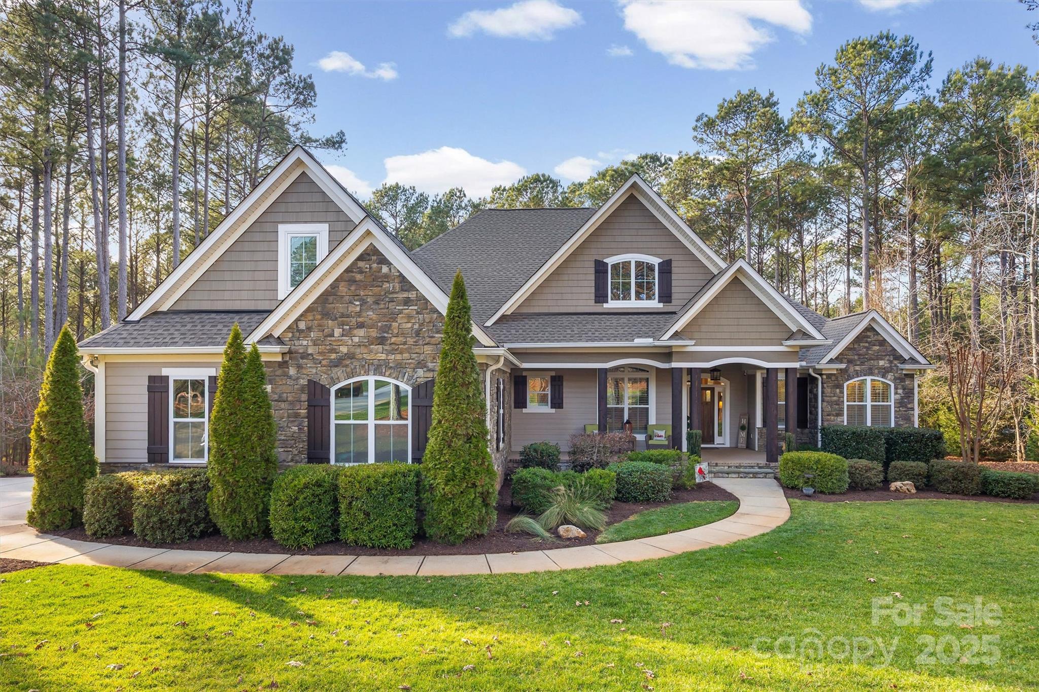 Stunning custom-built home situated within the coveted Riverchase Estates community, a gated luxury development known for its wooded, estate-sized lots and custom construction. The home features convenient single story living with 3 spacious bedrooms plus a dedicated office, and a bonus room above the garage. Designed with a split bedroom and open floor plan, the home incorporates an abundance of custom finishes including tasteful hardwood floors throughout. The great room features a vaulted ceiling with wood beams. The gourmet kitchen features custom cabinets including soft close drawers and doors, granite countertops, tile backsplash, a large center island, gas cooktop, custom vent hood, wall oven and microwave, and a farmhouse style sink. The primary bedroom boasts dual closets with custom solid shelving and a spa-like bath with dual sink vanity, large soaking tub and walk in tile shower. Large laundry room with cabinets for storage, sink and counter space. Drop zone with built in cubbies. Oversized 2 car garage with room for 2 cars plus a golf cart and plenty of storage and workspace. Bonus room over garage with walk in storage area. 

The exterior of the property offers extensive landscaping, irrigation, a covered front porch and a screened rear porch, alongside a fire pit and paver patio for the ultimate outdoor living. Riverchase Estates provides residents with a range of amenities, including a clubhouse, fitness center, outdoor pool, game courts, and access to the Catawba River. Easy access to Highway 521 making this a short drive to areas like Indian Land, Ballantyne, and Fort Mill.
