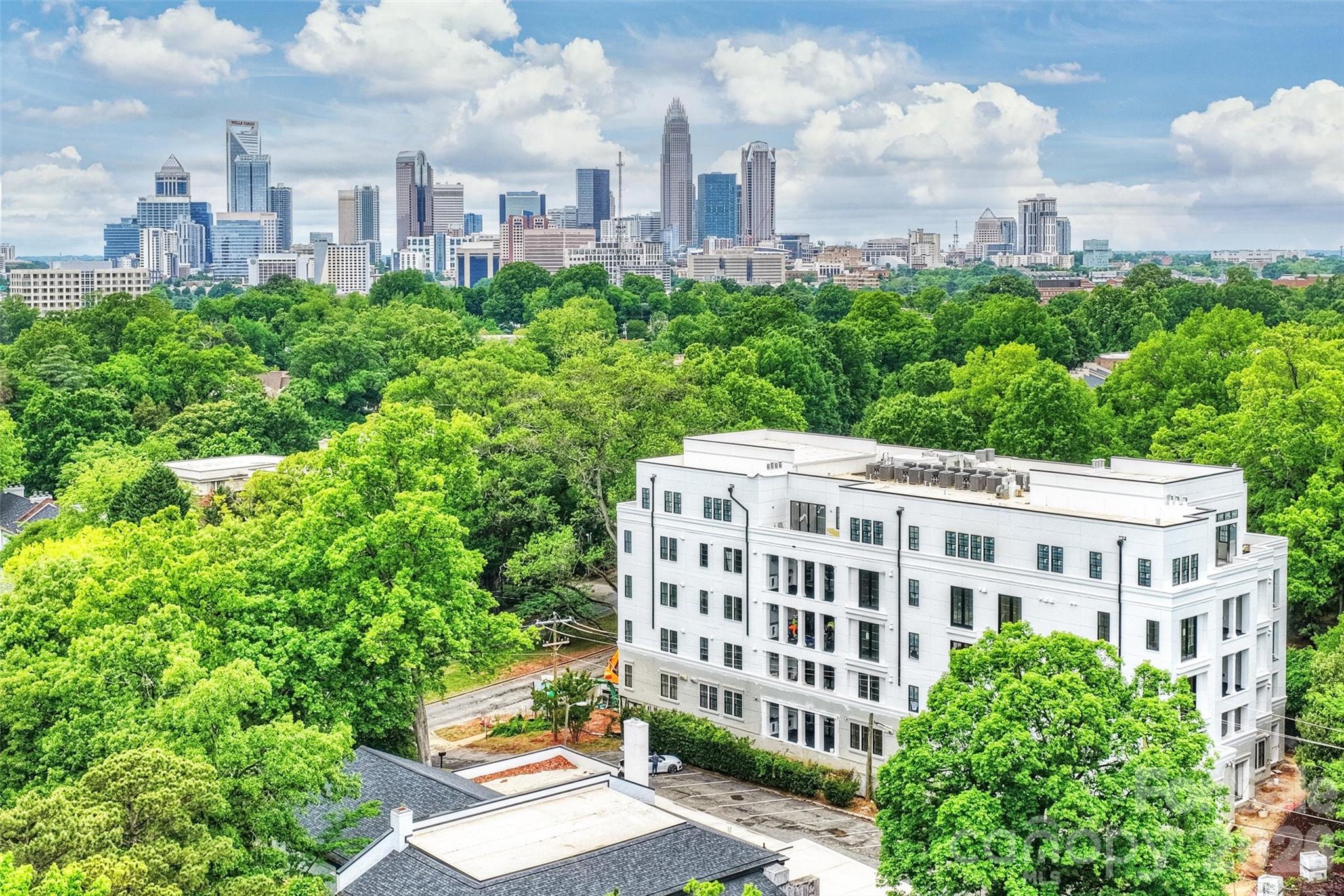 Discover unparalleled luxury and secure, seamless living at 409 Queens, a distinguished collection of 17 single-level residences nestled within Charlotte's most coveted Myers Park neighborhood. This boutique condominium community offers its enviable location, set beneath towering Oak Trees and steeped in historic charm as its premier amenity.Each residence is a testament to sophisticated design, featuring curated and impeccably appointed interiors. Thoughtfully designed floor plans include integrated gourmet kitchens, an expansive great room, a dedicated dining area, and large sliding glass doors that open onto private terraces, extending the living space outdoors.Comfort and privacy are paramount. All bedrooms are equipped with an ensuite bath and generous closet space. Every home is appointed with luxury features, including an outdoor grill, a wine refrigerator, and pre-wiring for an EV charging station.Community amenities further enhance the maintenance-free lifestyle with gated parking, a stylish club room, fitness center and beautifully manicured exterior green spaces, ensuring both privacy and security for residents.